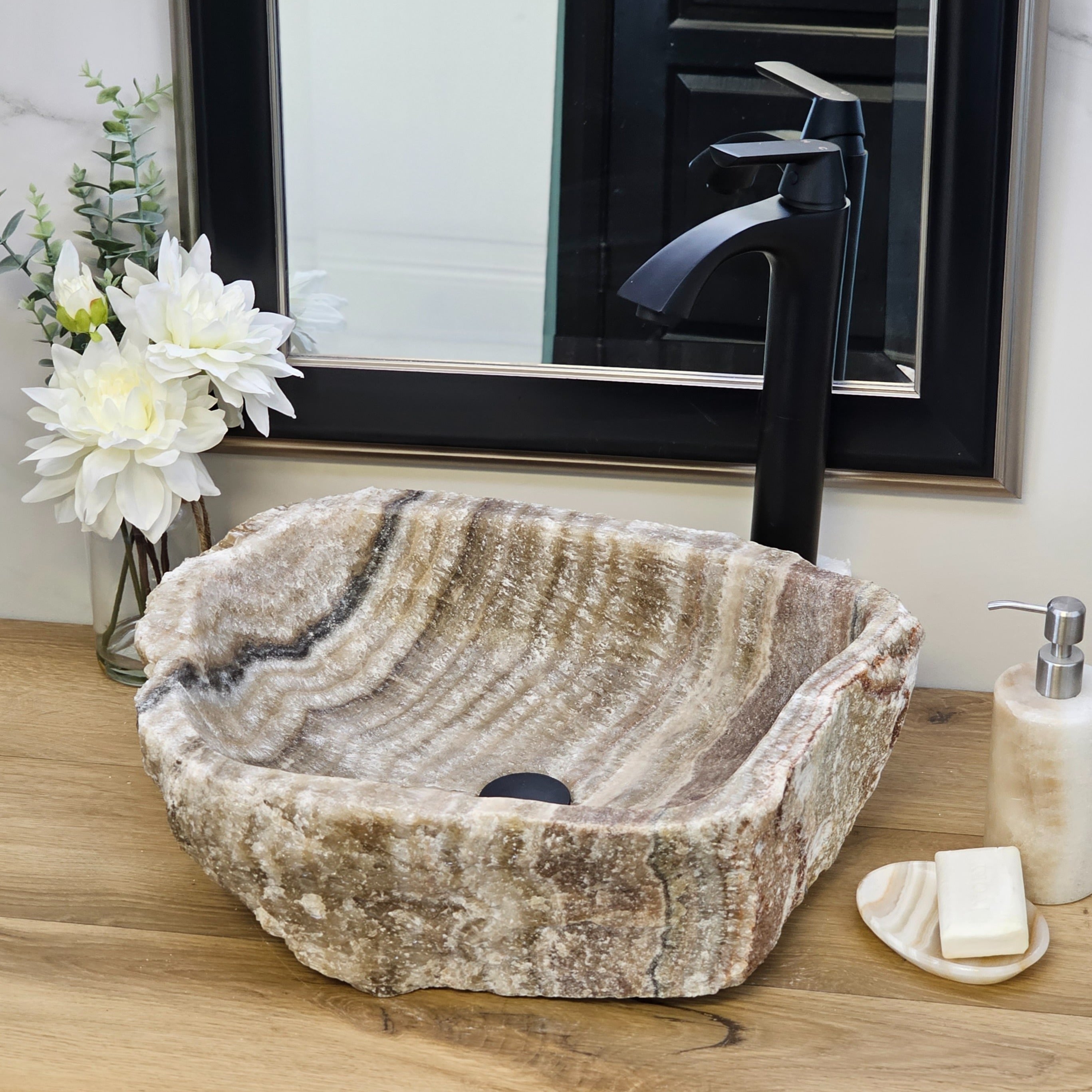 Brown and Tan Onyx Vessel Sink. A beautiful work of art. We offer fast shipping. Handmade in Mexico. We hand finish, package, and ship from the USA. Buy now at www.felipeandgrace.com.
