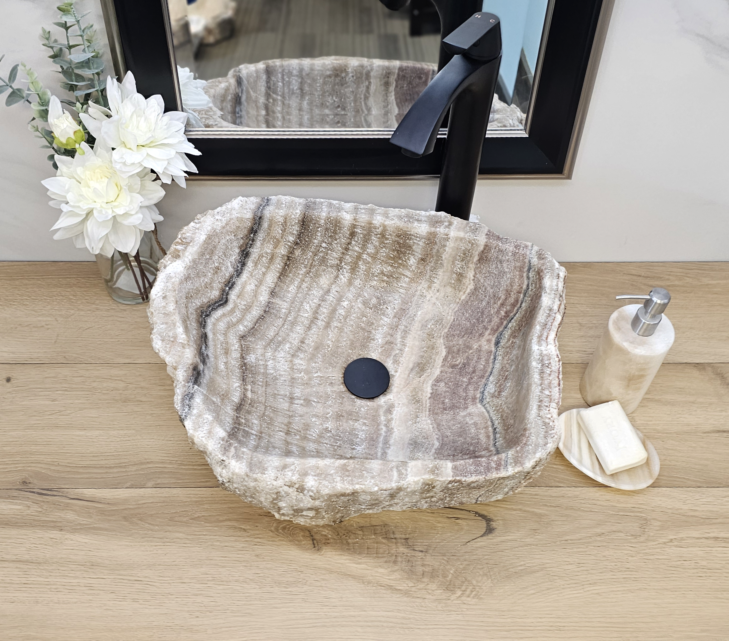 Brown and Tan Onyx Vessel Sink. A beautiful work of art. We offer fast shipping. Handmade in Mexico. We hand finish, package, and ship from the USA. Buy now at www.felipeandgrace.com.