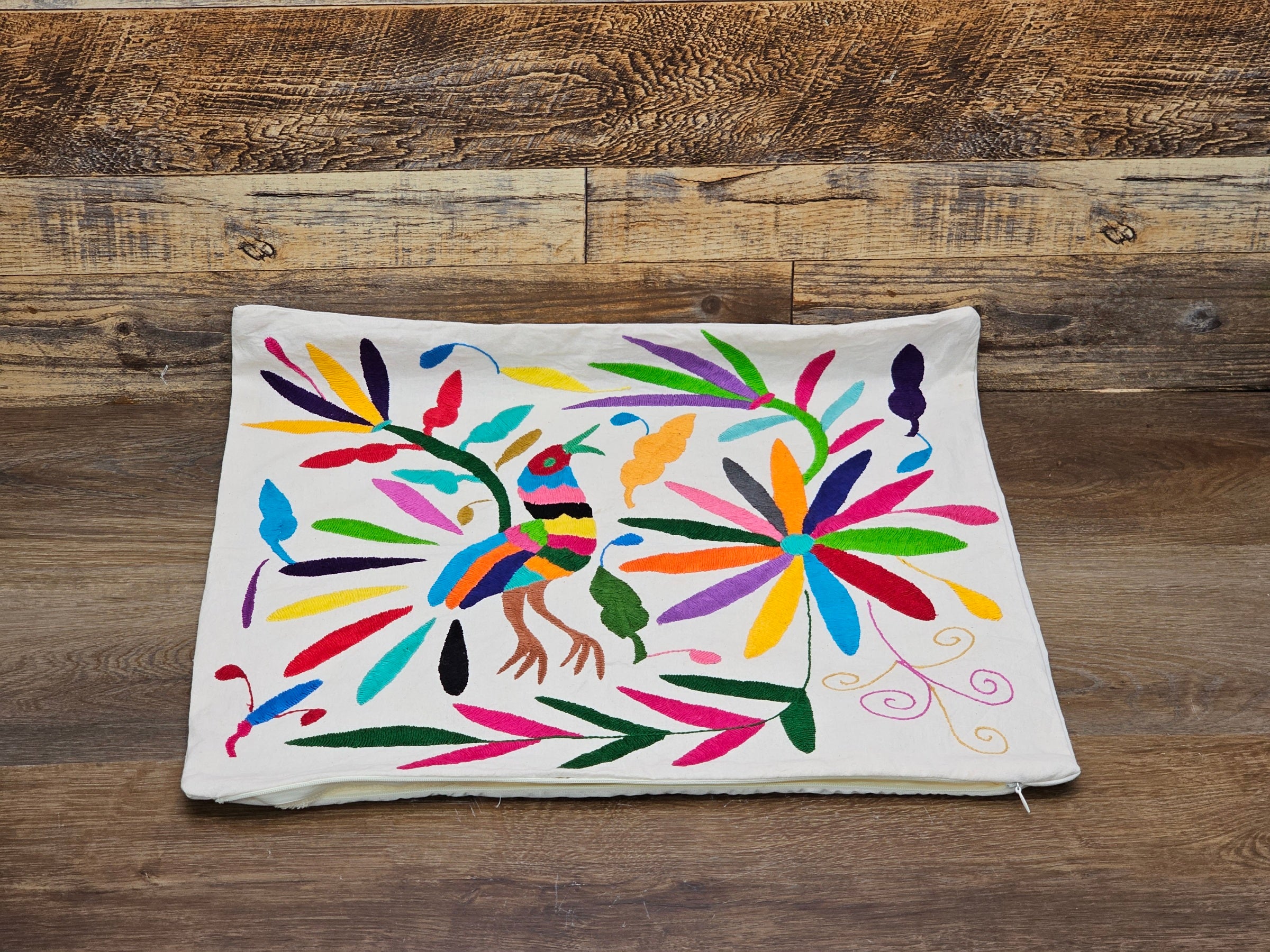 Rectangle Otomi Tenango Pillow Cover with Hand Embroidered Birds, Flowers, and Animals in Vibrant Colors. Handmade in Mexico. Ships from the USA. Buy now at www.felipeandgrace.com.
