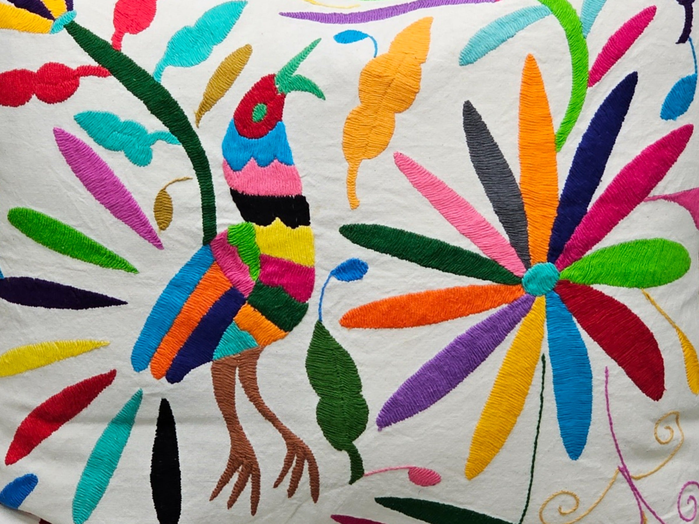 Rectangle Otomi Tenango Pillow Cover with Hand Embroidered Birds, Flowers, and Animals in Vibrant Colors. Handmade in Mexico. Ships from the USA. Buy now at www.felipeandgrace.com.