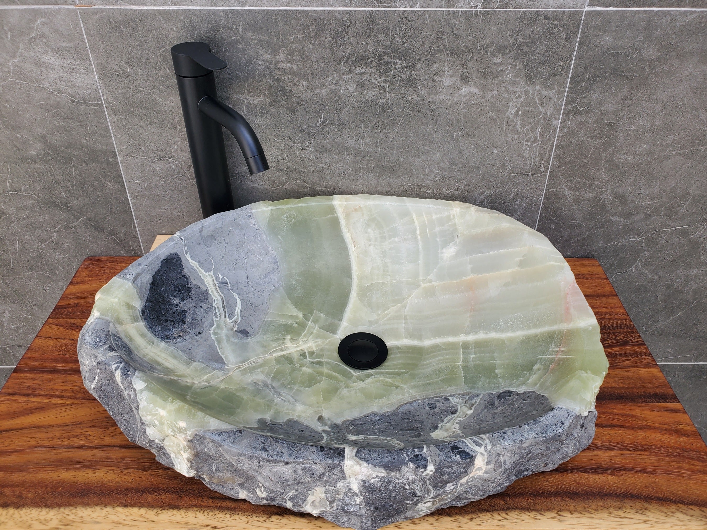 Green and Gray Onyx Stone Vessel Sink. It is one of a kind and a beautiful work of art. Handmade in Mexico. Hand Finished in the USA. Ships from the USA. A beautiful work of art. Buy now at www.felipeandgrace.com.