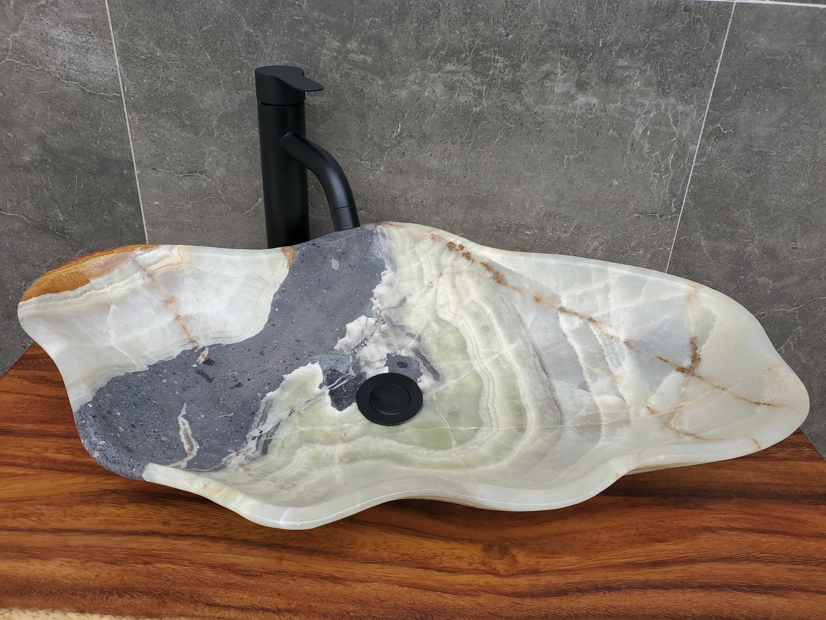 Green and Gray Onyx Stone Bathroom Vessel Sink. Option to Customize Drain Size. A beautiful work of art. We offer fast shipping. Handmade in Mexico. We hand finish, package, and ship from the USA. Buy now at www.felipeandgrace.com.