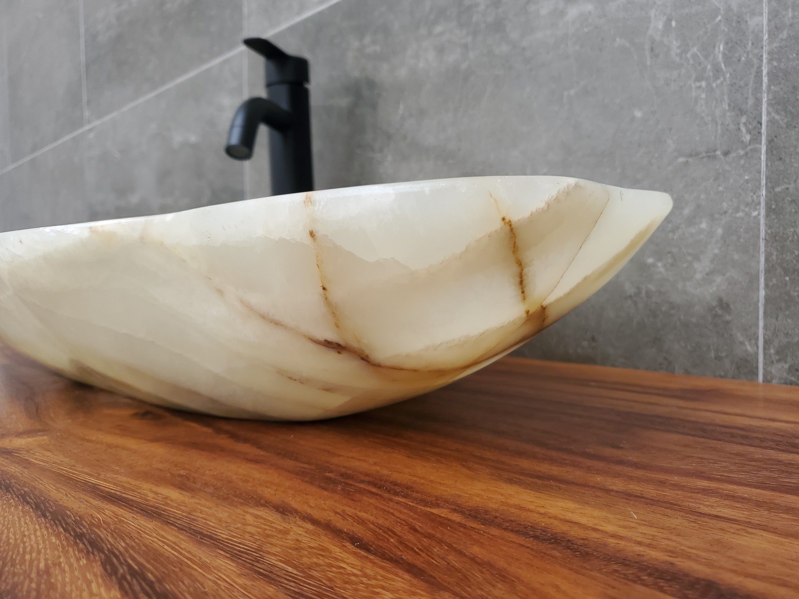 Green and Gray Onyx Stone Bathroom Vessel Sink. Option to Customize Drain Size. A beautiful work of art. We offer fast shipping. Handmade in Mexico. We hand finish, package, and ship from the USA. Buy now at www.felipeandgrace.com.