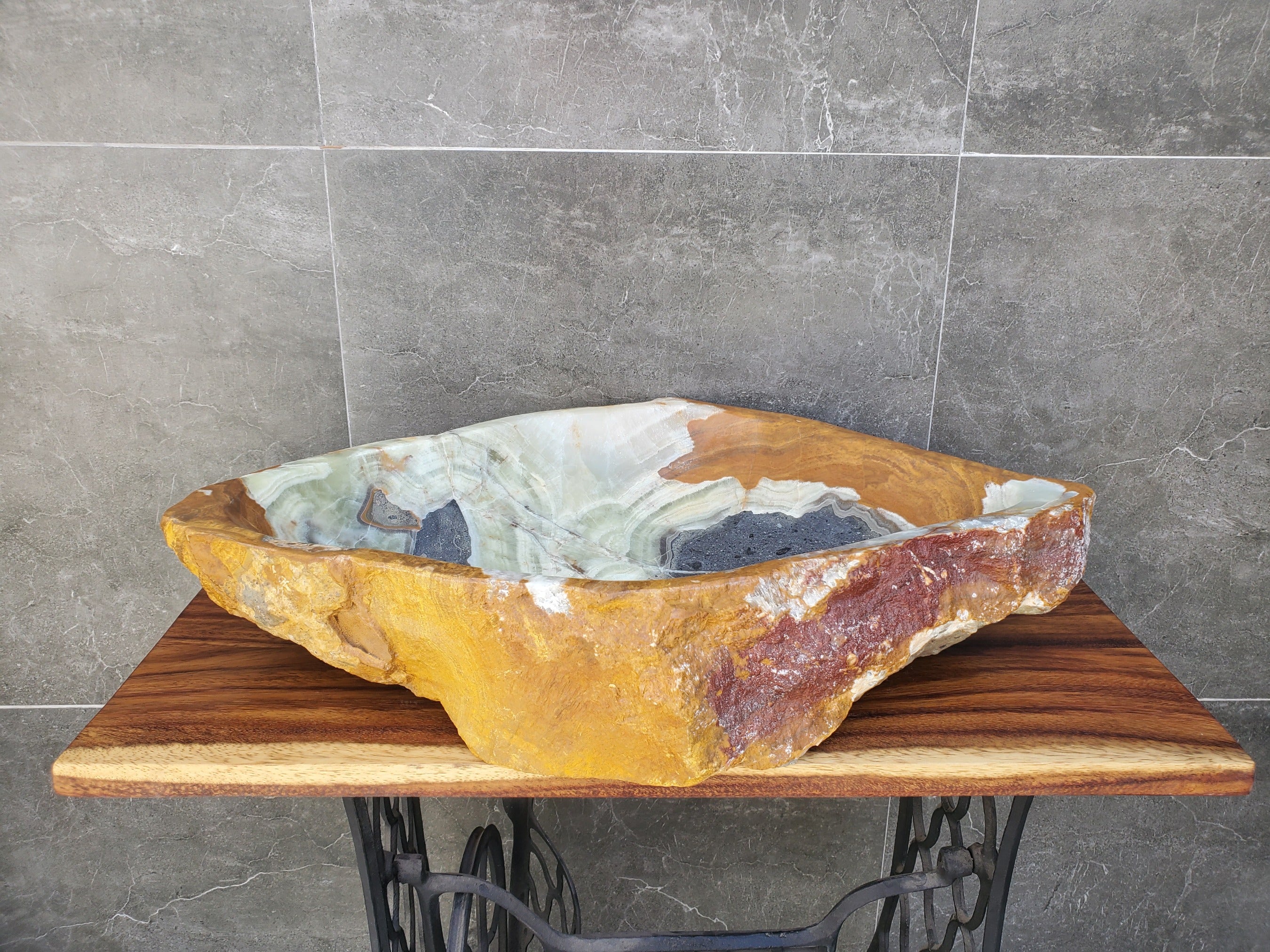 Green, Gray and Brown Onyx Stone Vessel Sink. It is one of a kind. Handmade in Mexico. Hand Finished in the USA. Ships from the USA. A beautiful work of art. Buy now at www.felipeandgrace.com.
