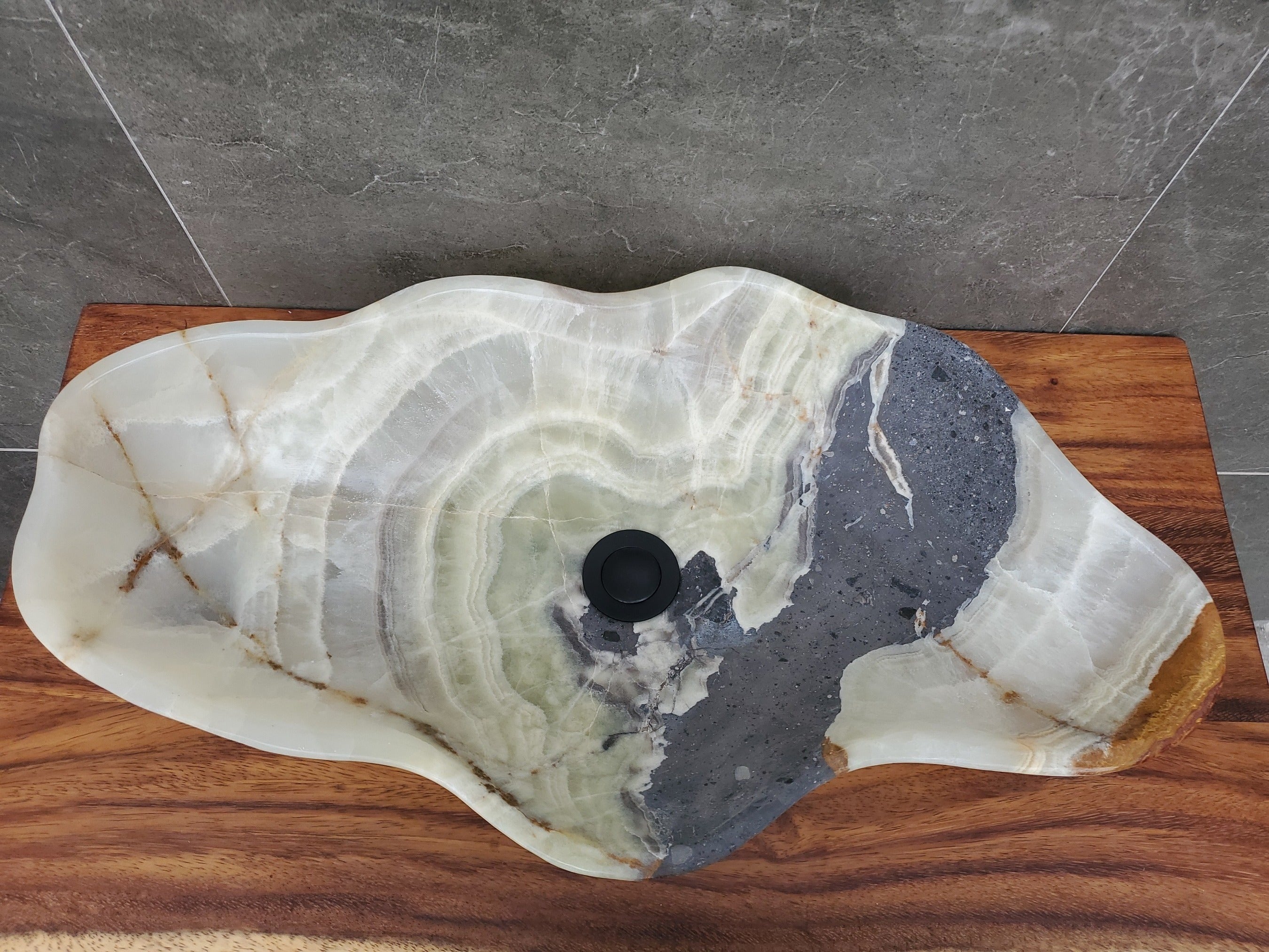 Green and Gray Onyx Stone Bathroom Vessel Sink. Option to Customize Drain Size. A beautiful work of art. We offer fast shipping. Handmade in Mexico. We hand finish, package, and ship from the USA. Buy now at www.felipeandgrace.com.