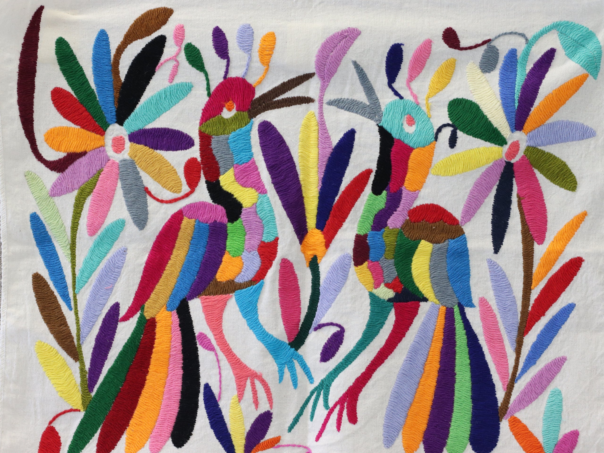 Otomi Tenango Placemat or Frameable Art Handmade with Embroidered Birds, Flowers, and Animals in Vibrant Colors. Handmade in Mexico. Ships from the USA. Buy now at www.felipeandgrace.com.