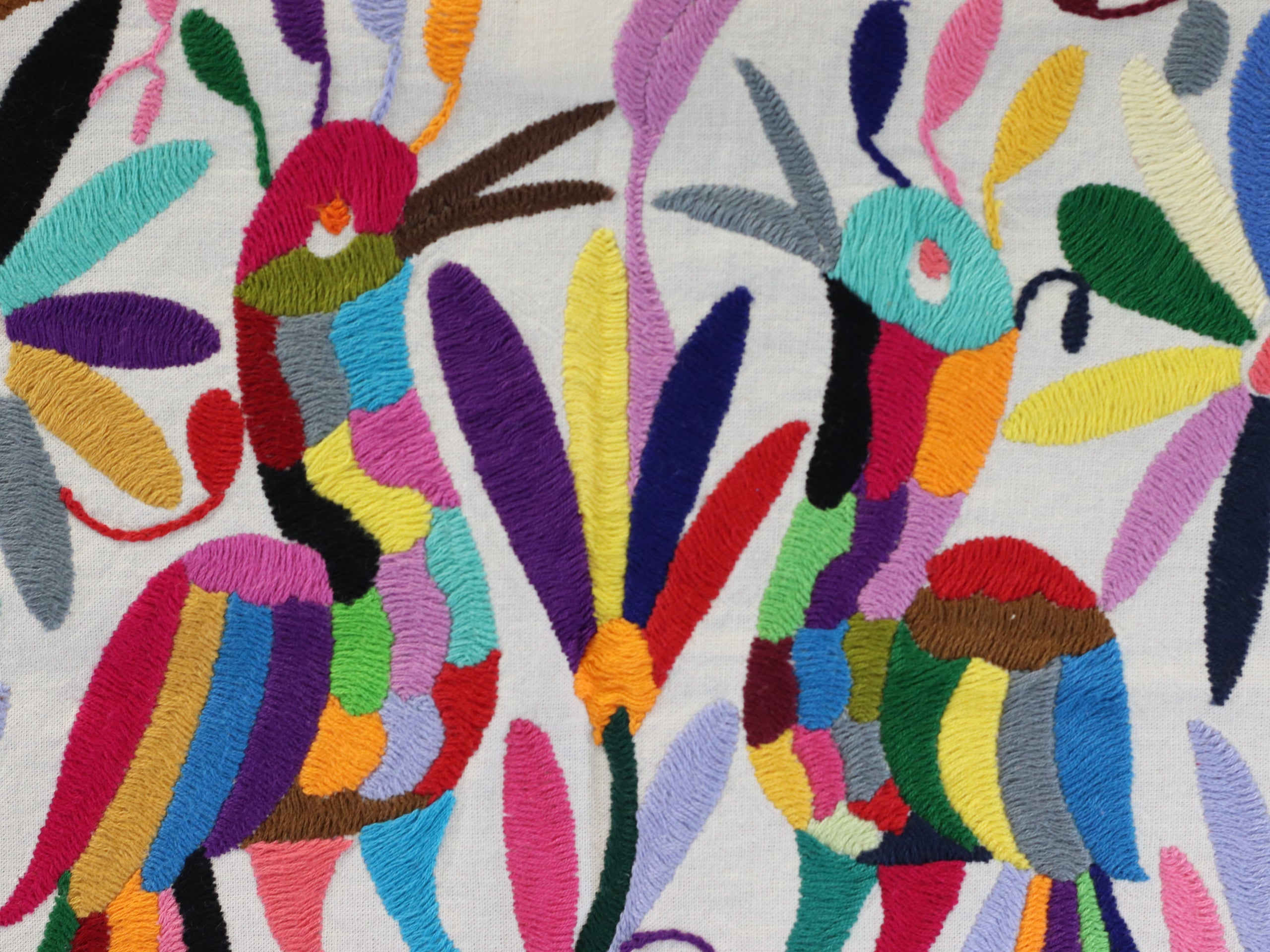 Otomi Tenango Placemat or Frameable Art Handmade with Embroidered Birds, Flowers, and Animals in Vibrant Colors. Handmade in Mexico. Ships from the USA. Buy now at www.felipeandgrace.com.