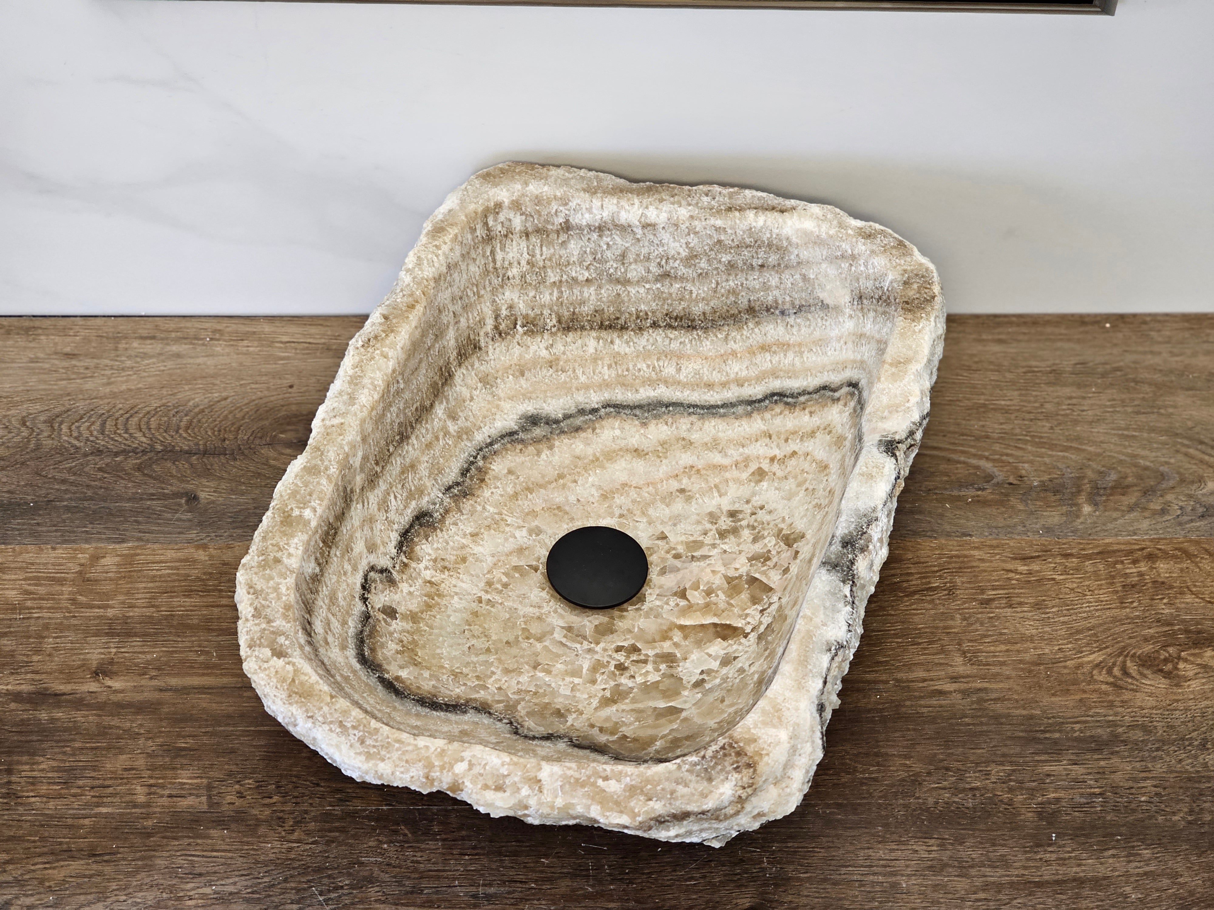 Brown and Beige Onyx Vessel Bathroom Sink. Irregular Shape. We offer fast shipping. Handmade in Mexico. We hand finish, package, and ship from the USA. Buy now at www.felipeandgrace.com.