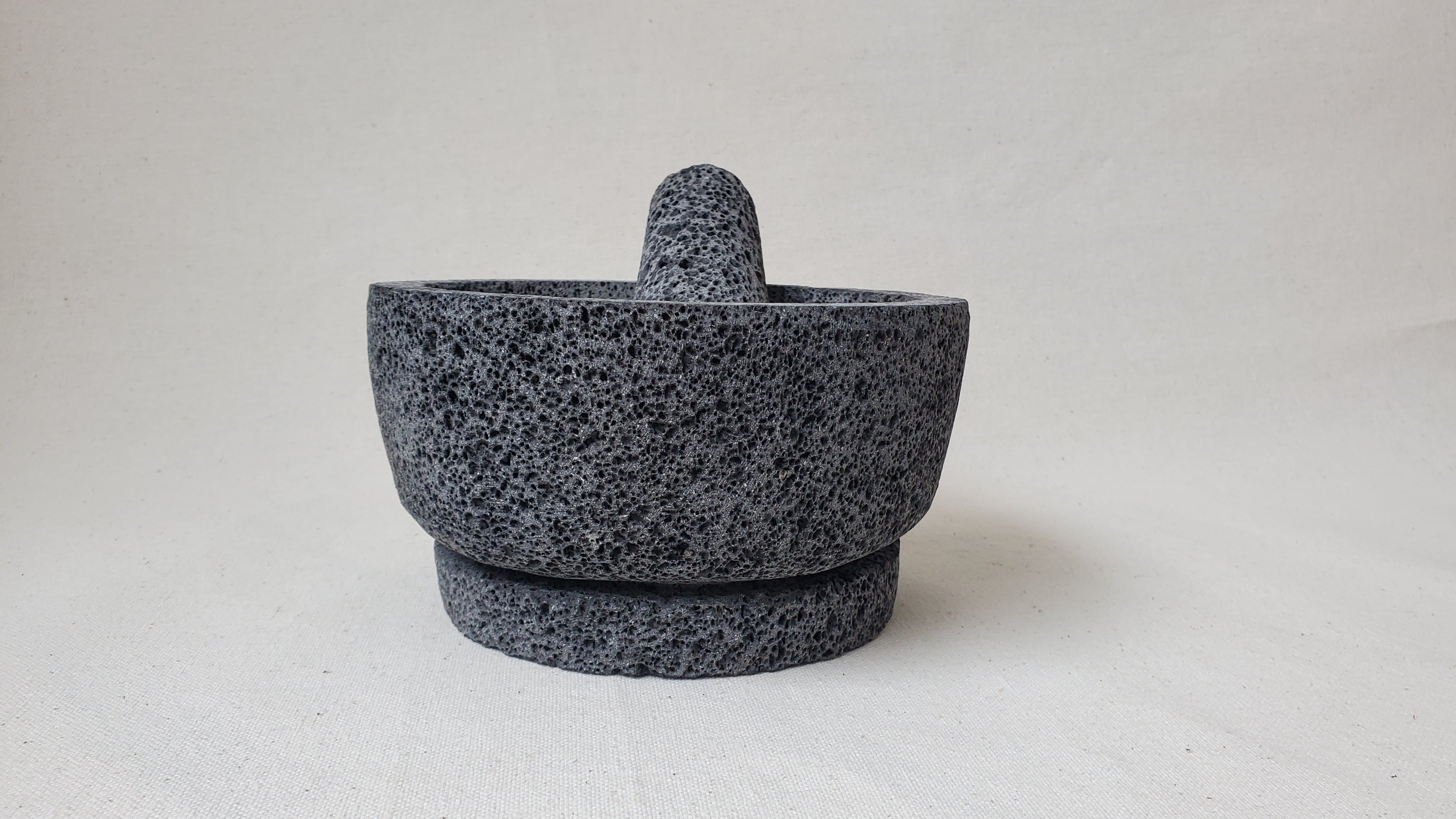 Authentic 8-inch Molcajete Pestle and Mortar Set. Made of pure basalt volcanic lava rock. Handmade in Mexico using traditional techniques. We hand finish, package, and ship from the USA. Buy now at www.felipeandgrace.com.