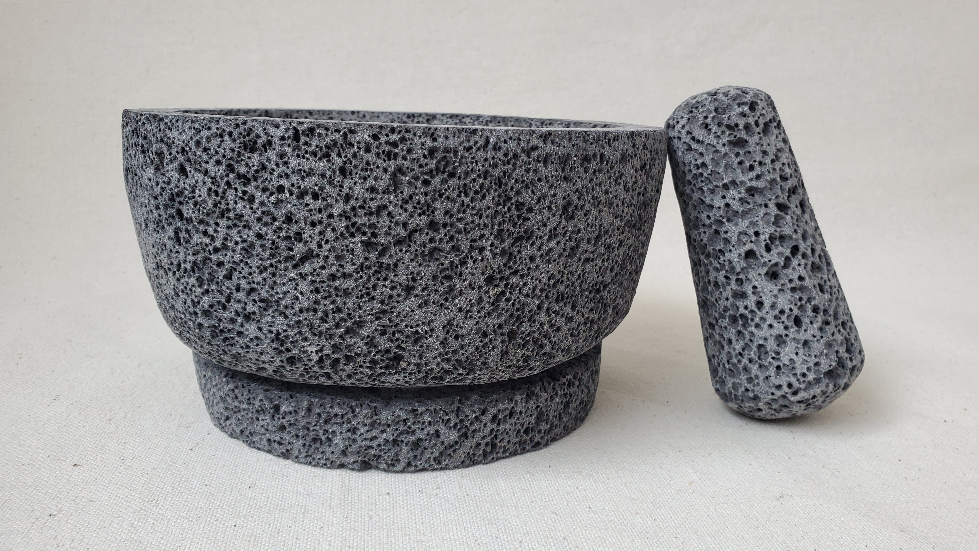 Authentic 8-inch Molcajete Pestle and Mortar Set. Made of pure basalt volcanic lava rock. Handmade in Mexico using traditional techniques. We hand finish, package, and ship from the USA. Buy now at www.felipeandgrace.com.