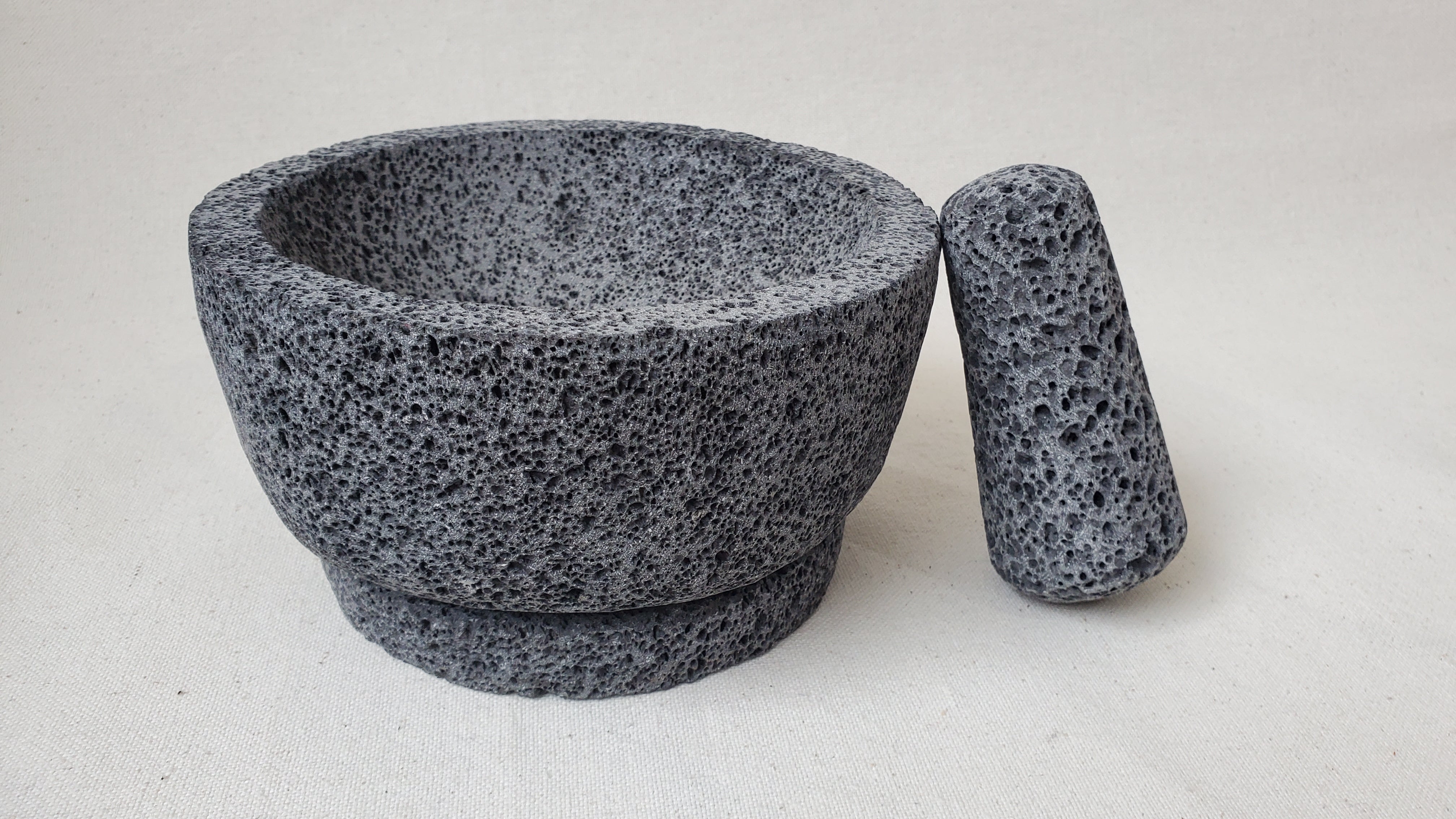 Authentic 8-inch Molcajete Pestle and Mortar Set. Made of pure basalt volcanic lava rock. Handmade in Mexico using traditional techniques. We hand finish, package, and ship from the USA. Buy now at www.felipeandgrace.com.
