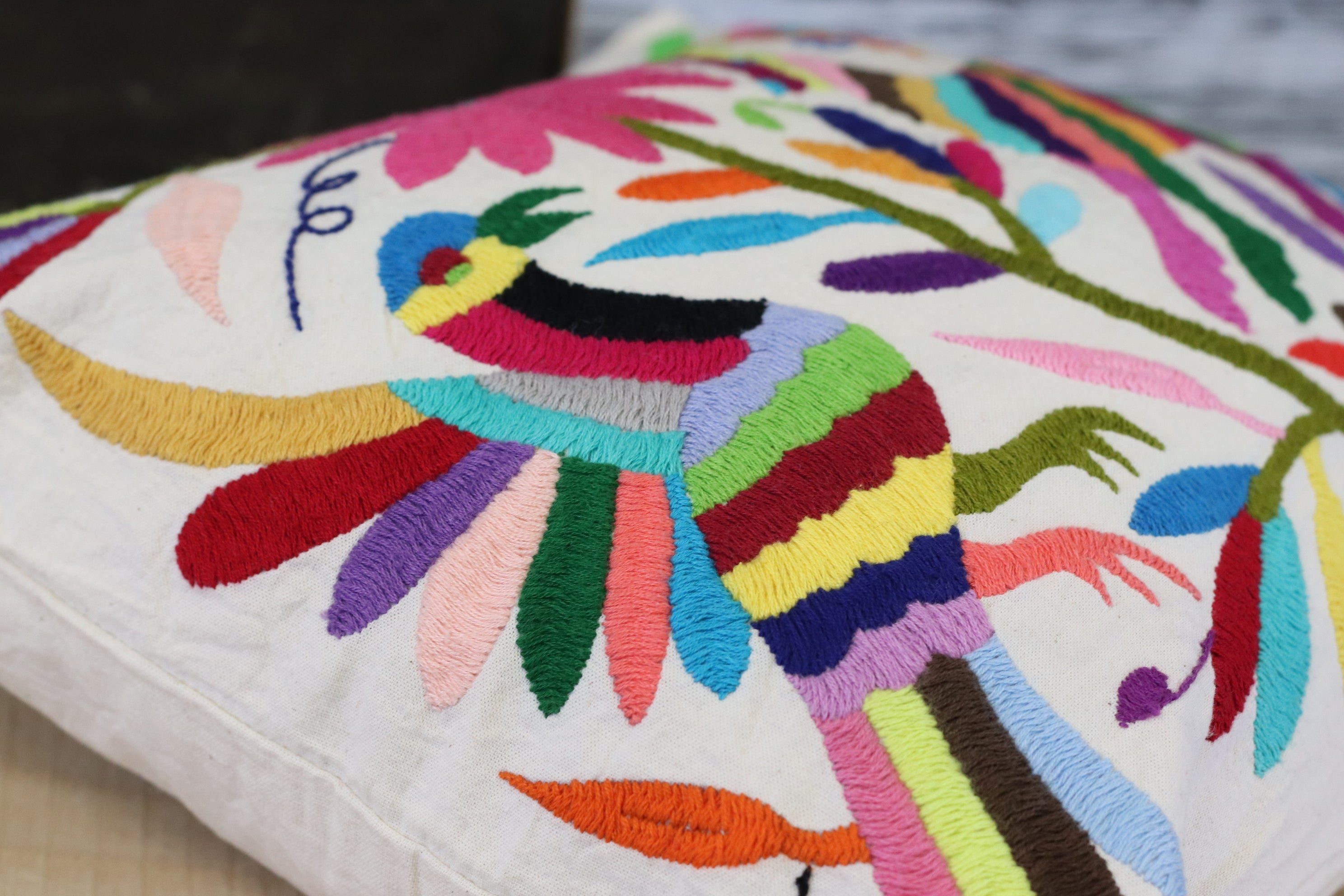 Rectangle Otomi Tenango Pillow Cover with Hand Embroidered Birds, Flowers, and Animals in Vibrant Colors. Handmade in Mexico. Ships from the USA. Buy now at www.felipeandgrace.com.