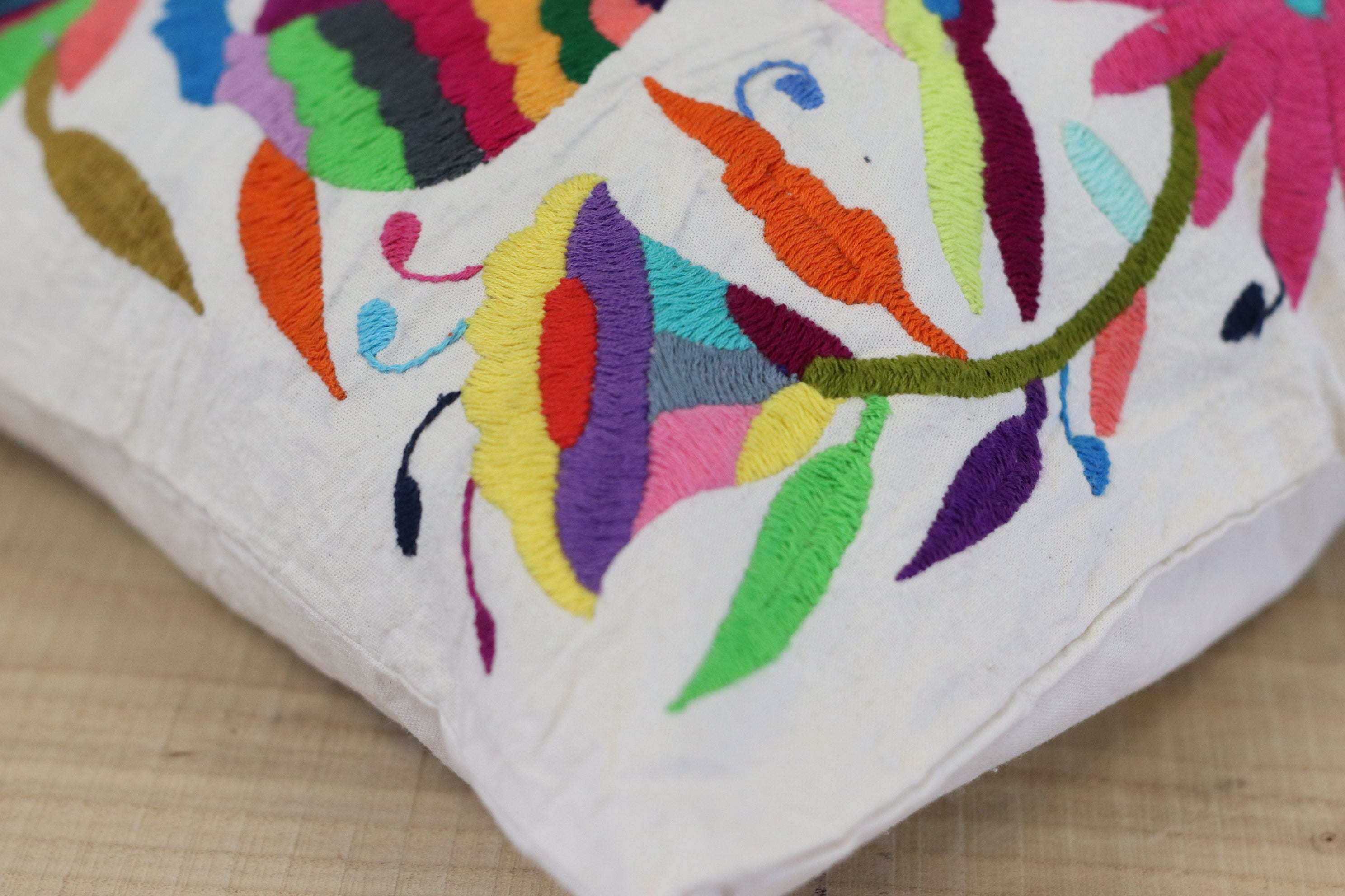 Rectangle Otomi Tenango Pillow Cover with Hand Embroidered Birds, Flowers, and Animals in Vibrant Colors. Handmade in Mexico. Ships from the USA. Buy now at www.felipeandgrace.com.
