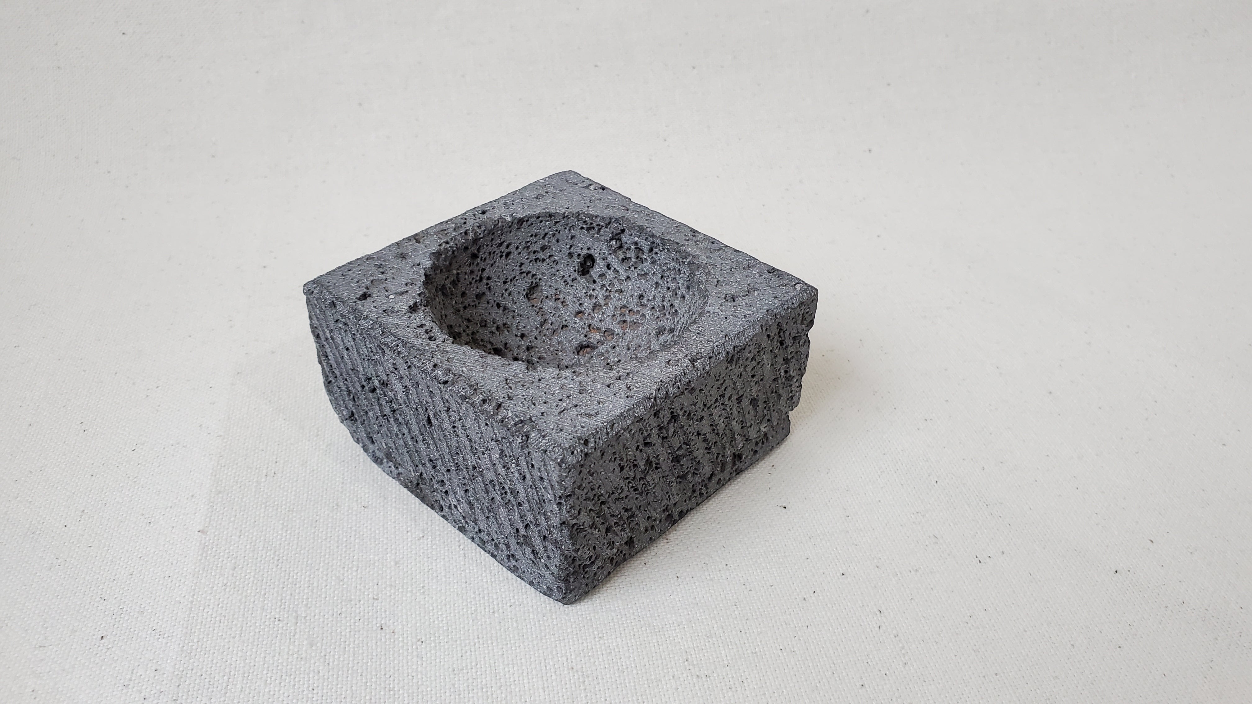 Three Square Serving Bowls on a Rectangle Wooden Base. Made of Basalt Lava Rock Volcanic Stone. Handmade in Mexico using traditional techniques. We hand finish, package, and ship from the USA. Buy now at www.felipeandgrace.com.
