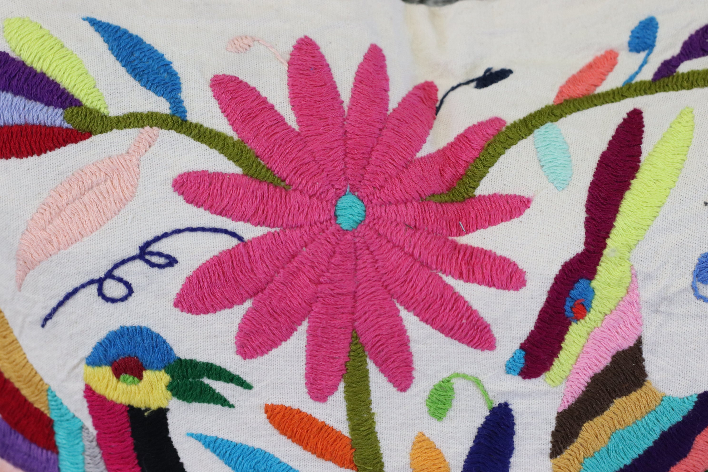 Rectangle Otomi Tenango Pillow Cover with Hand Embroidered Birds, Flowers, and Animals in Vibrant Colors. Handmade in Mexico. Ships from the USA. Buy now at www.felipeandgrace.com.