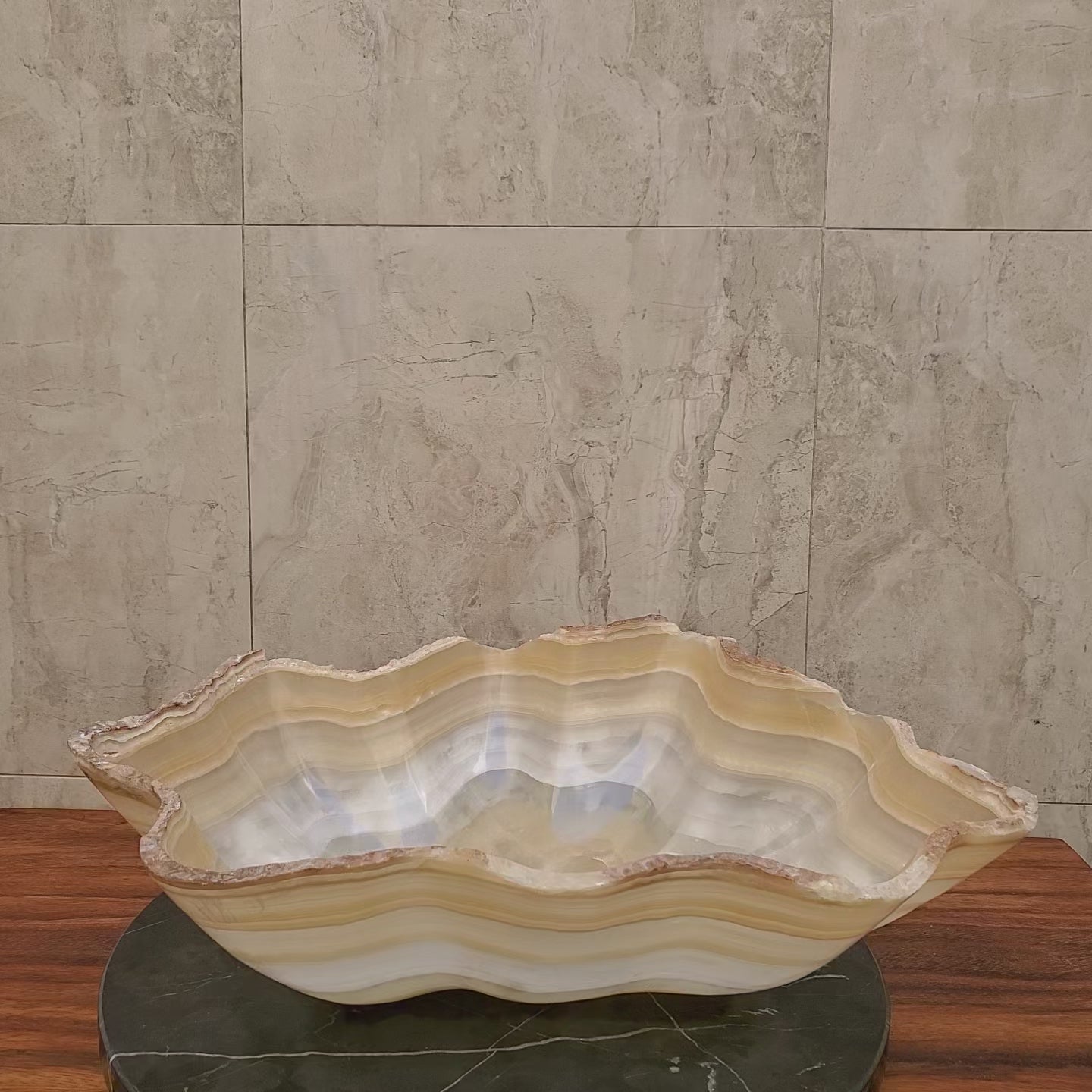 Beige and White Onyx Oyster Shell Shaped Vessel Sink. Handmade in Mexico. We hand finish and ship from the USA. Buy now at www.felipeandgrace.com.