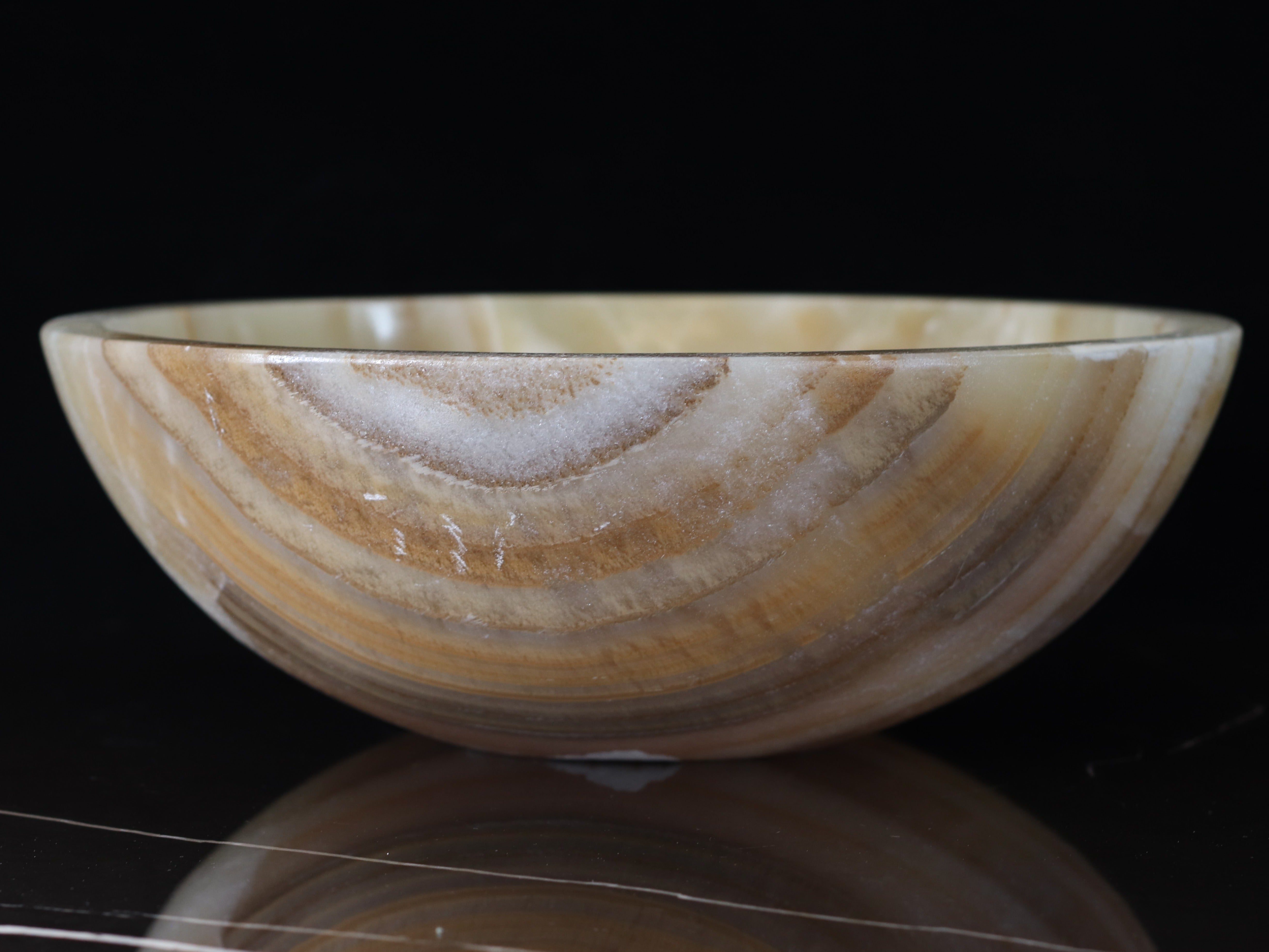 Brown and Tan Onyx Stone Vessel Sink. Made to sit above the counter. This sink has a polished finish. We hand finish, package, and ship from the USA. Buy now at www.felipeandgrace.com.