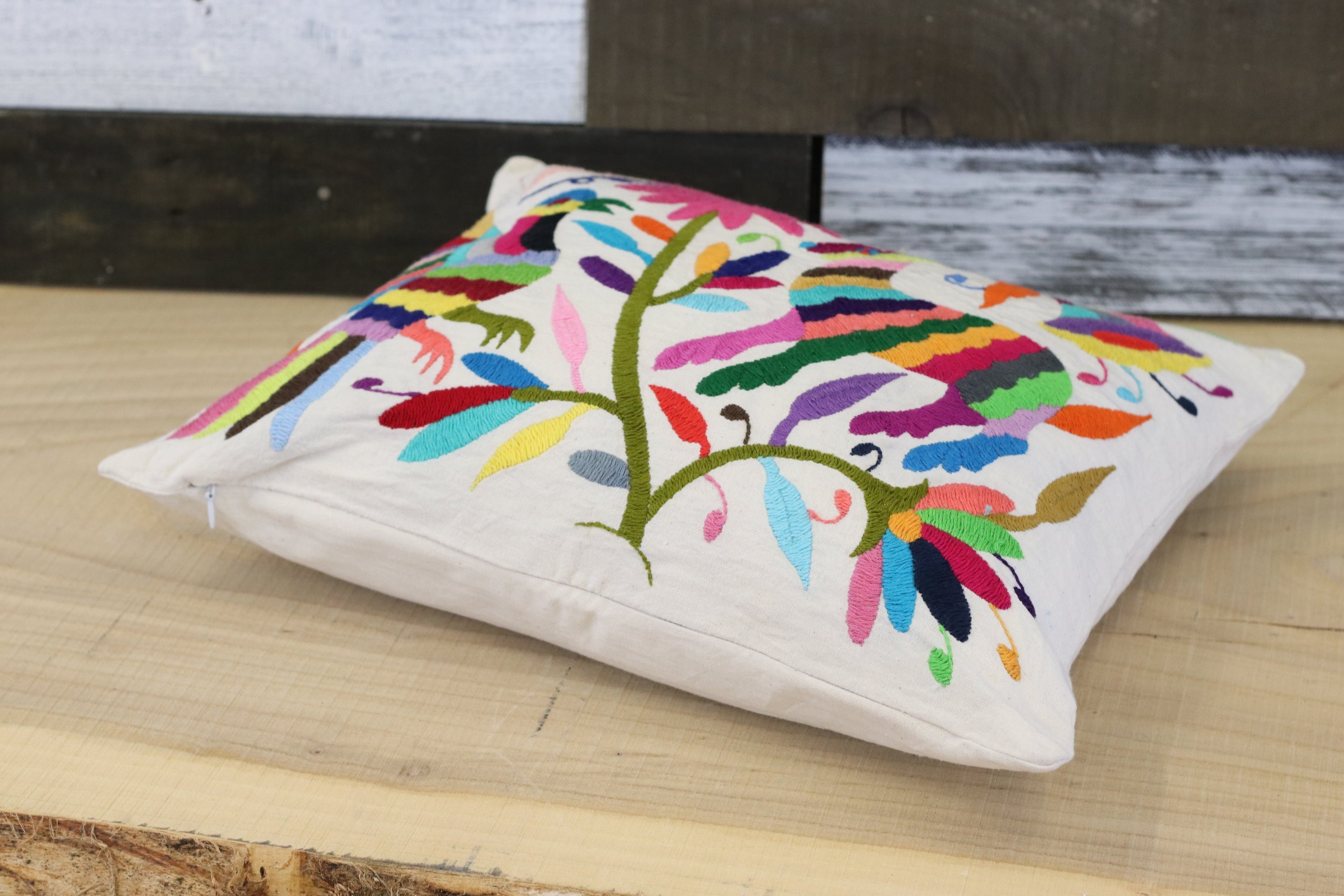 Rectangle Otomi Tenango Pillow Cover with Hand Embroidered Birds, Flowers, and Animals in Vibrant Colors. Handmade in Mexico. Ships from the USA. Buy now at www.felipeandgrace.com.