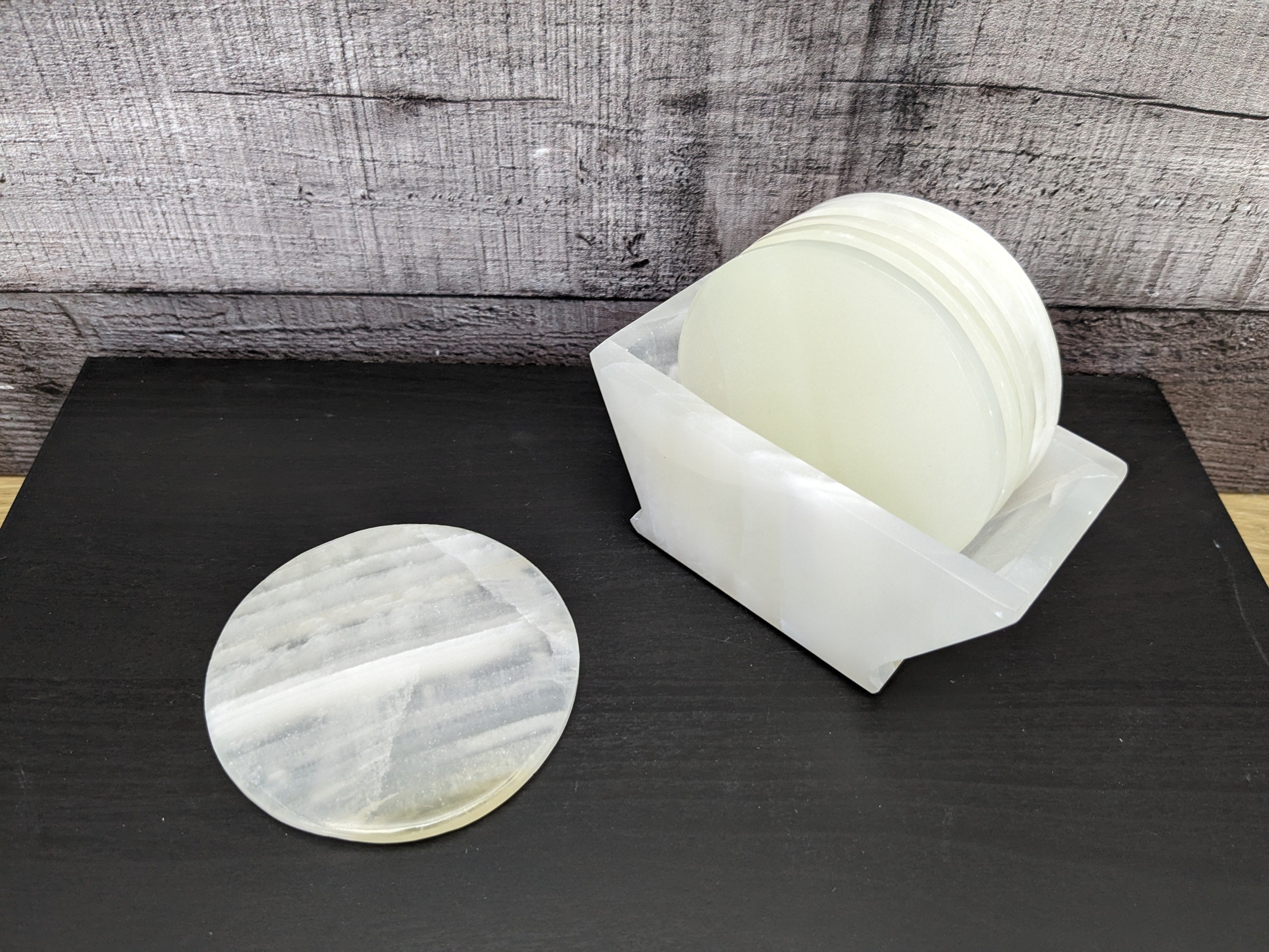 White Onyx Coaster Set of Six with Holder. The coasters are round. Handmade in Mexico. Ships from the USA. Buy now at www.felipeandgrace.com.