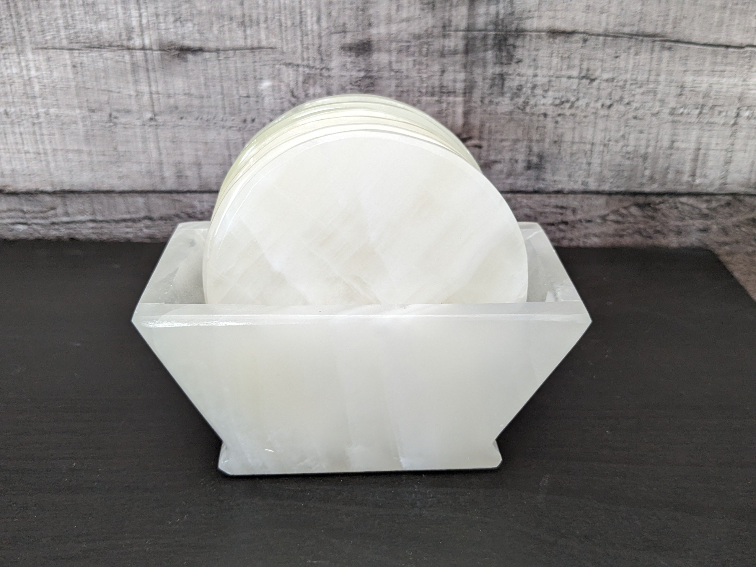 White Onyx Coaster Set of Six with Holder. The coasters are round. Handmade in Mexico. Ships from the USA. Buy now at www.felipeandgrace.com.