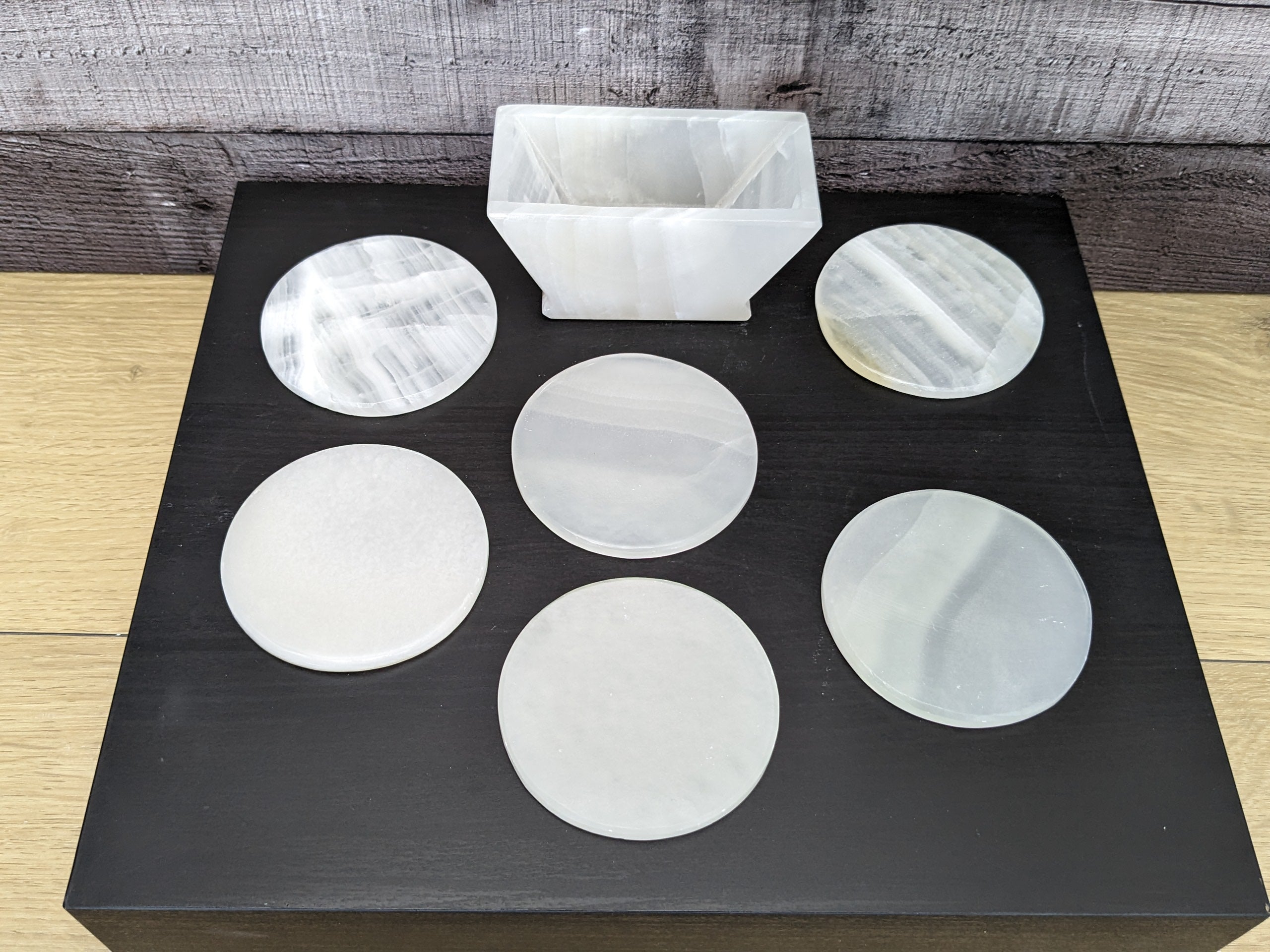 White Onyx Coaster Set of Six with Holder. The coasters are round. Handmade in Mexico. Ships from the USA. Buy now at www.felipeandgrace.com.