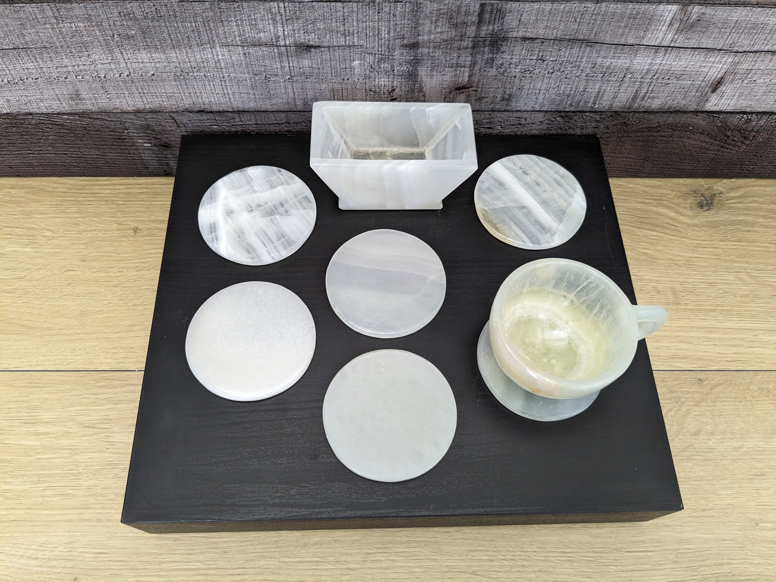 White Onyx Coaster Set of Six with Holder. The coasters are round. Handmade in Mexico. Ships from the USA. Buy now at www.felipeandgrace.com.