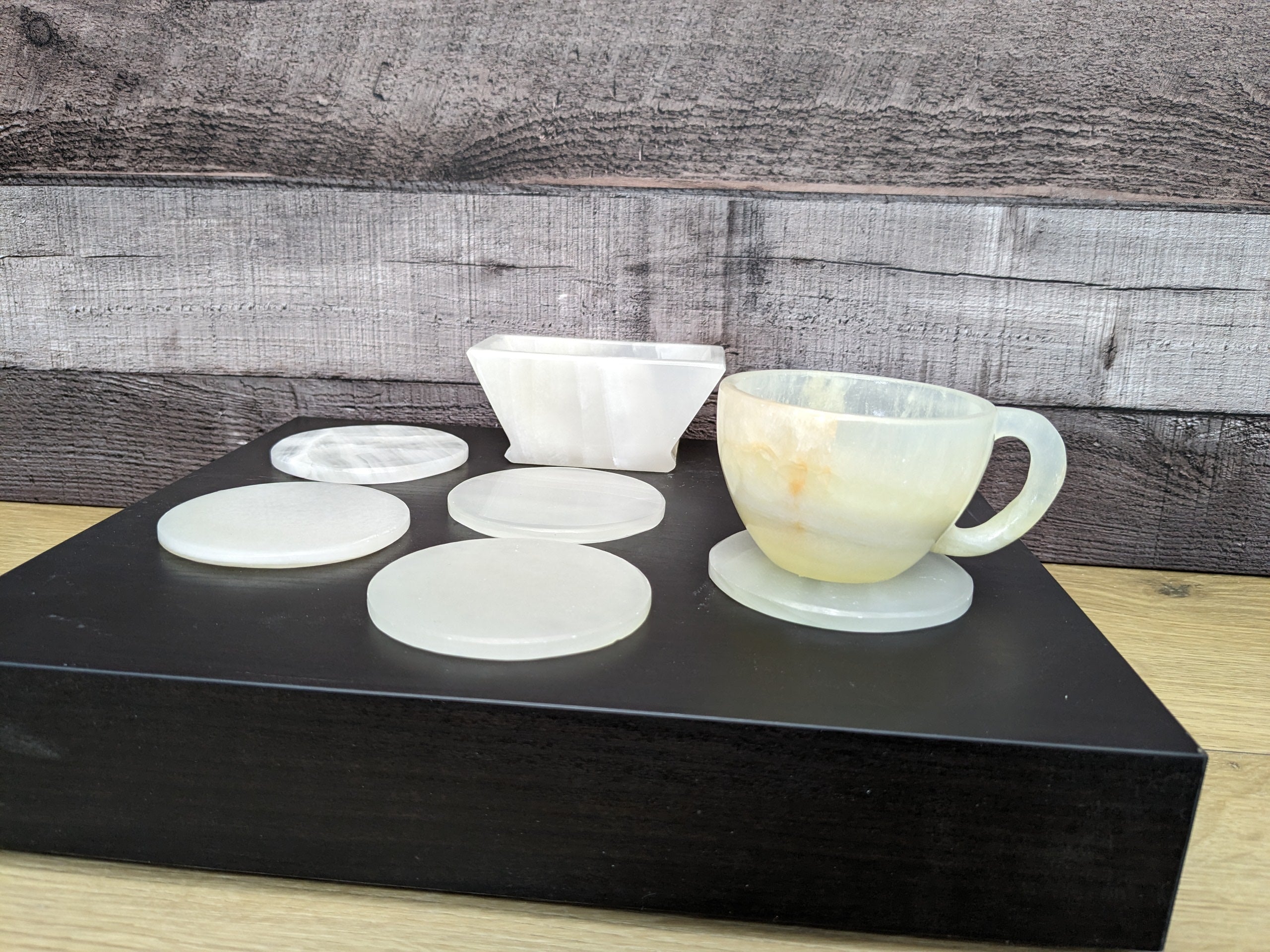 White Onyx Coaster Set of Six with Holder. The coasters are round. Handmade in Mexico. Ships from the USA. Buy now at www.felipeandgrace.com.
