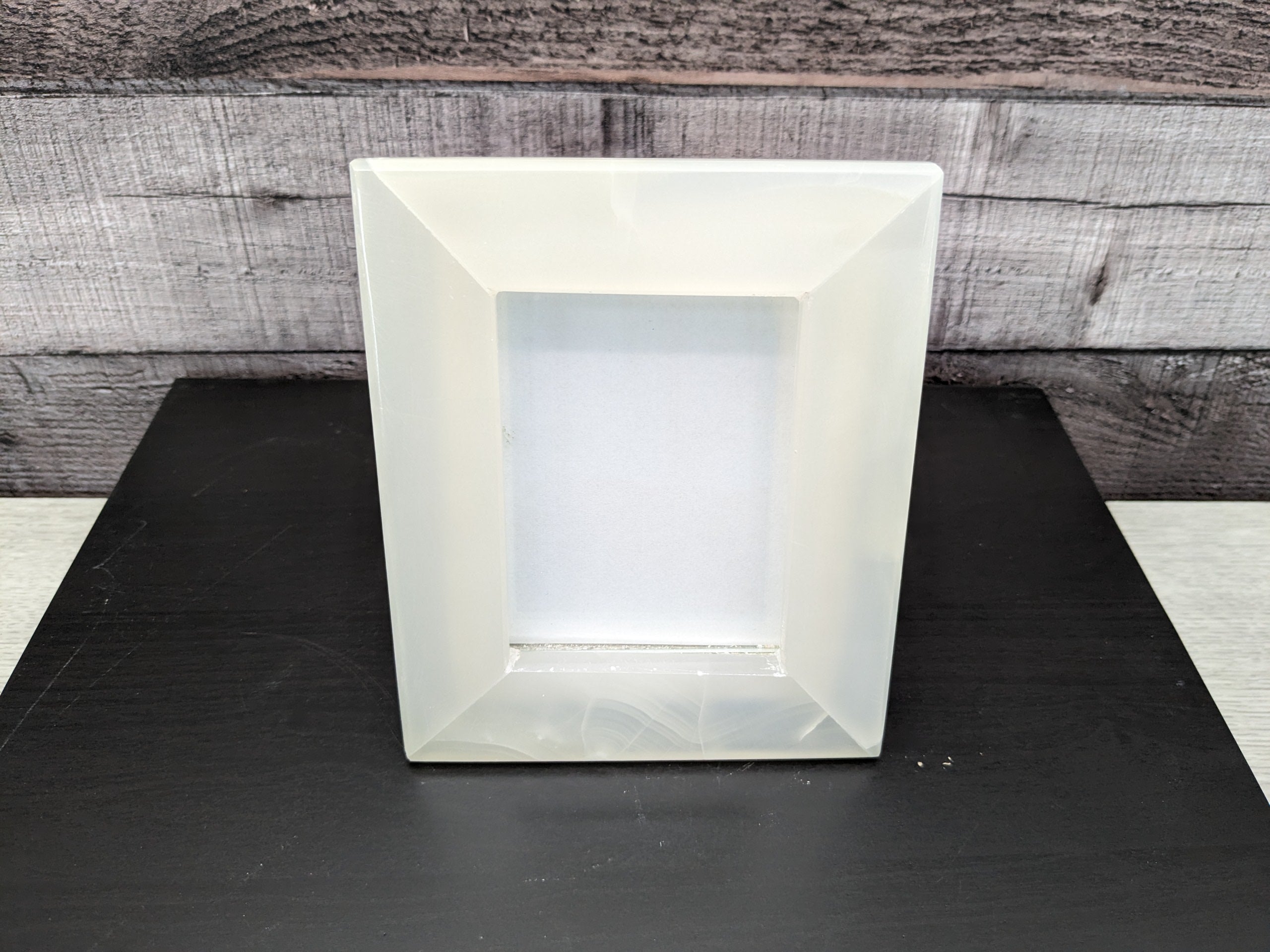 White Onyx Frame with Glass Covering and Travertine Stone Stand. Handmade in Mexico. We package and ship from the USA. Buy now at www.felipeandgrace.com.