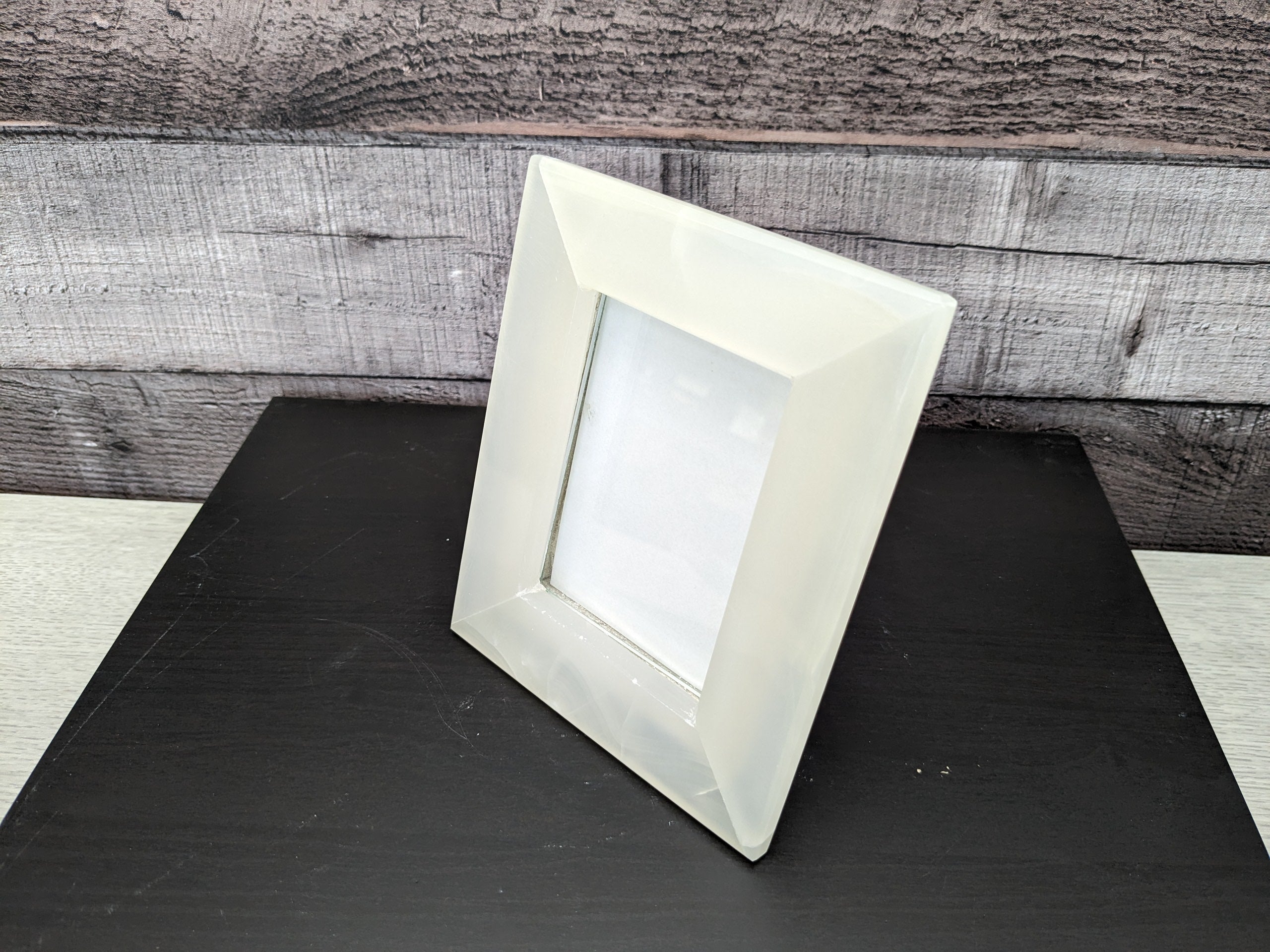 White Onyx Frame with Glass Covering and Travertine Stone Stand. Handmade in Mexico. We package and ship from the USA. Buy now at www.felipeandgrace.com.
