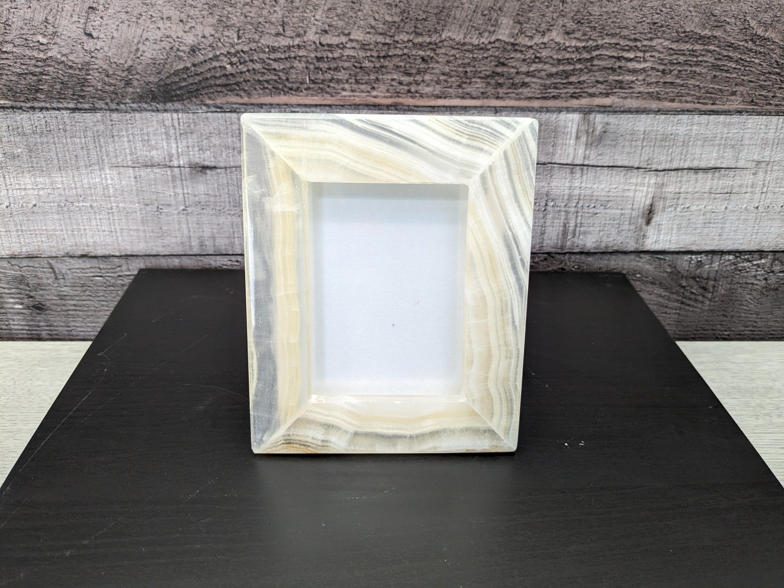 White Onyx Frame with Glass Covering and Travertine Stone Stand. Handmade in Mexico. We package and ship from the USA. Buy now at www.felipeandgrace.com.