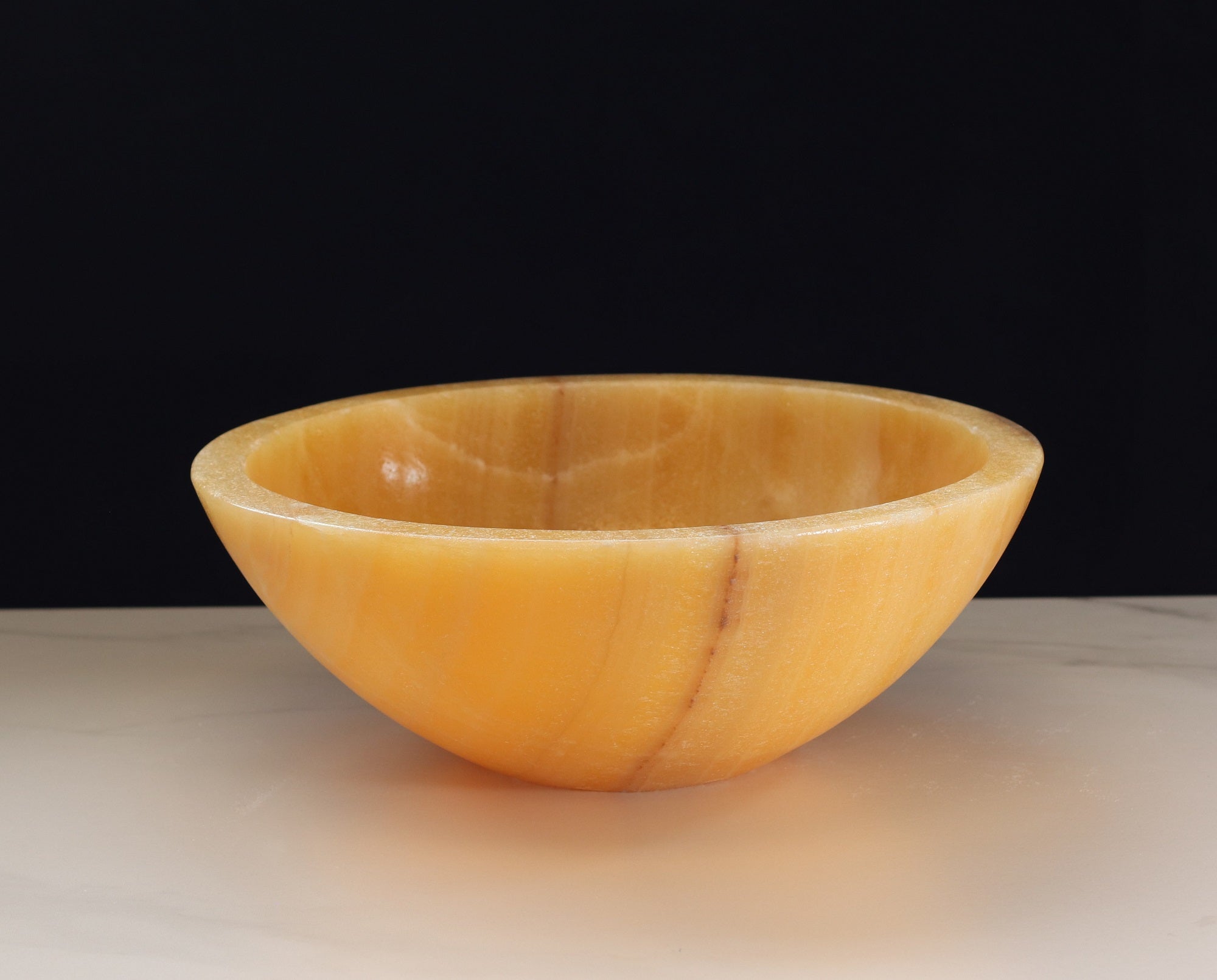 Beige and Orange Round Onyx Stone Bathroom Vessel Sink. A beautiful work of art. We offer fast shipping. Handmade in Mexico. We hand finish, package, and ship from the USA. Buy now at www.felipeandgrace.com.