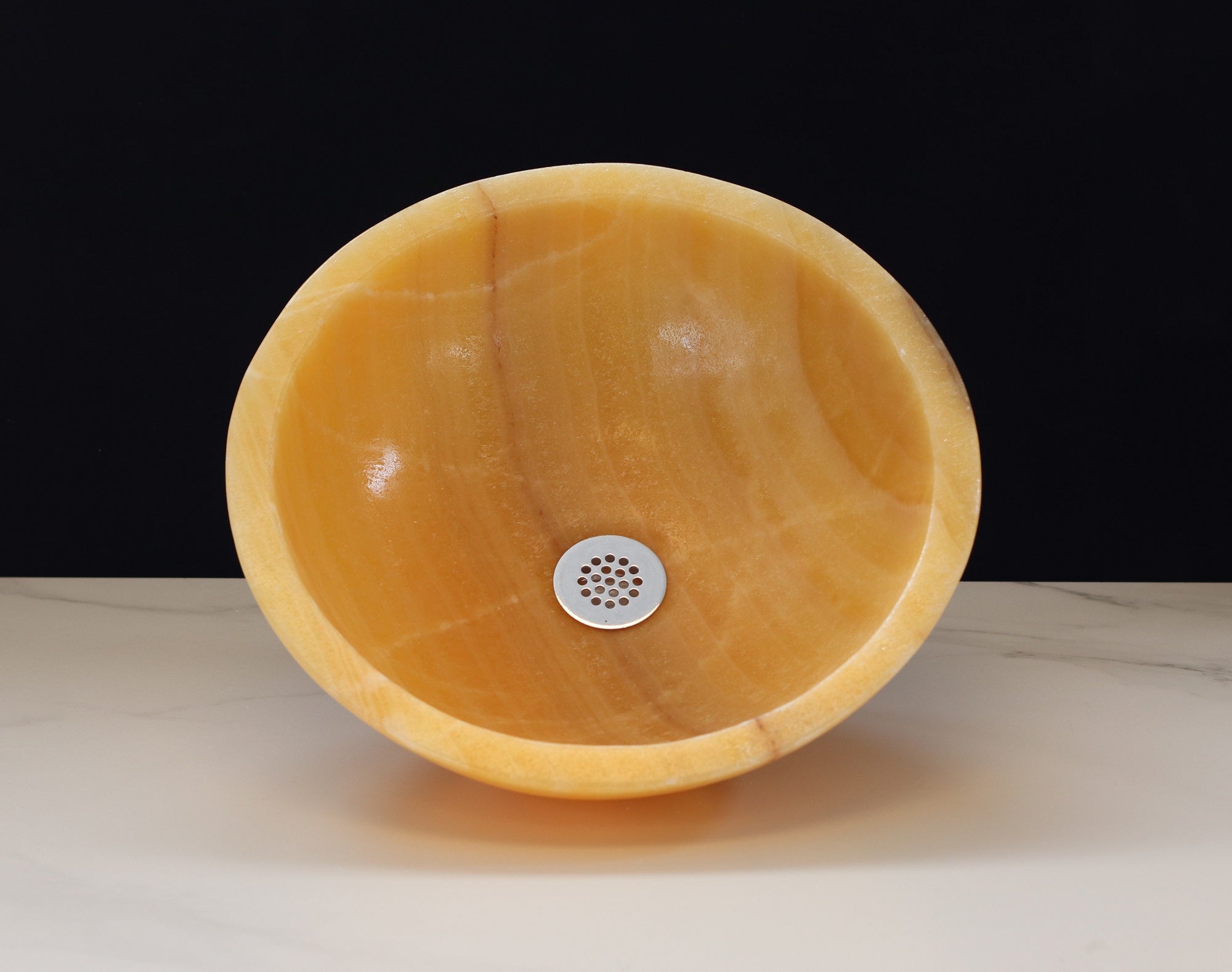 Beige and Orange Round Onyx Stone Bathroom Vessel Sink. A beautiful work of art. We offer fast shipping. Handmade in Mexico. We hand finish, package, and ship from the USA. Buy now at www.felipeandgrace.com.