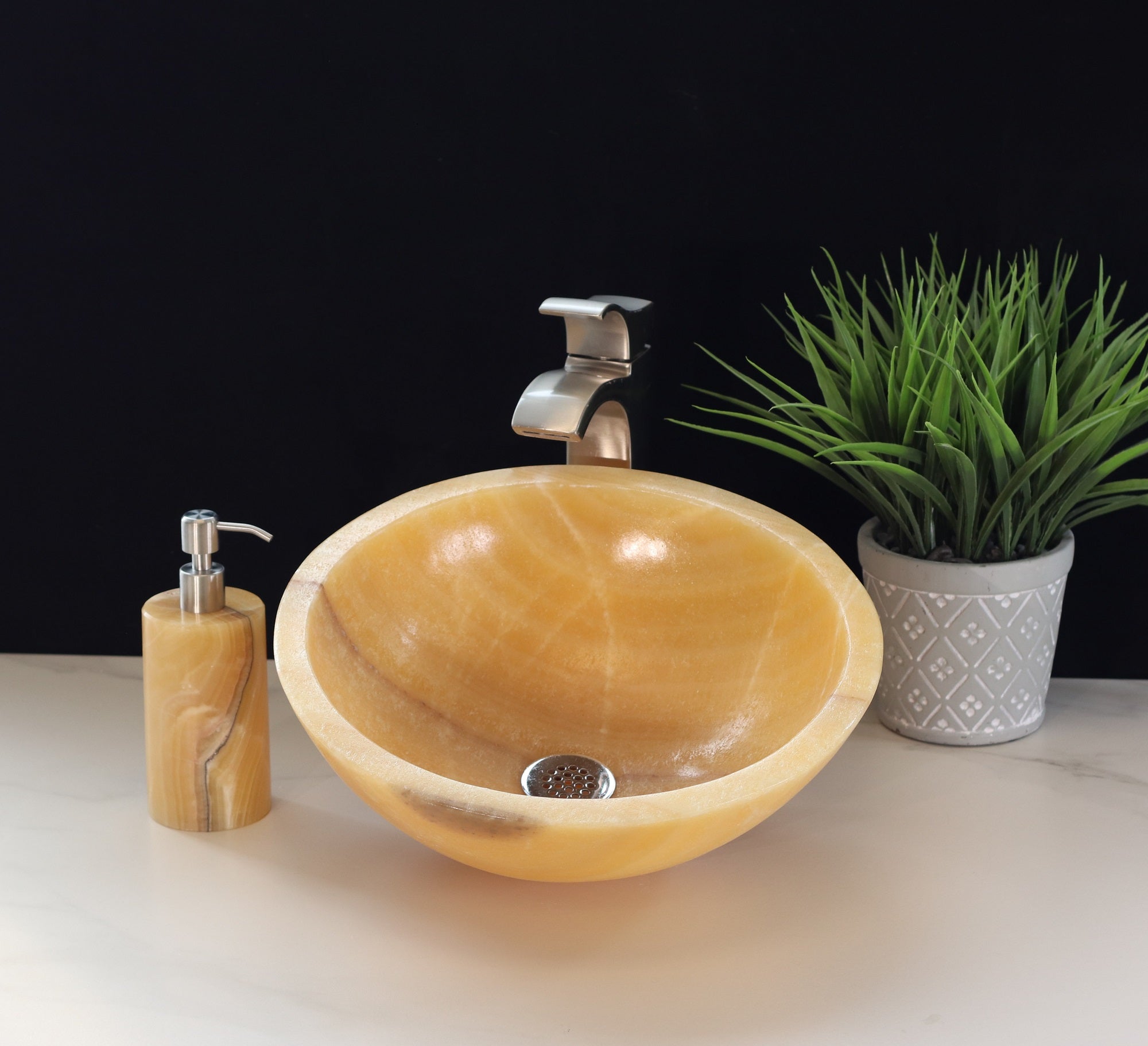 Beige and Orange Round Onyx Stone Bathroom Vessel Sink. A beautiful work of art. We offer fast shipping. Handmade in Mexico. We hand finish, package, and ship from the USA. Buy now at www.felipeandgrace.com.