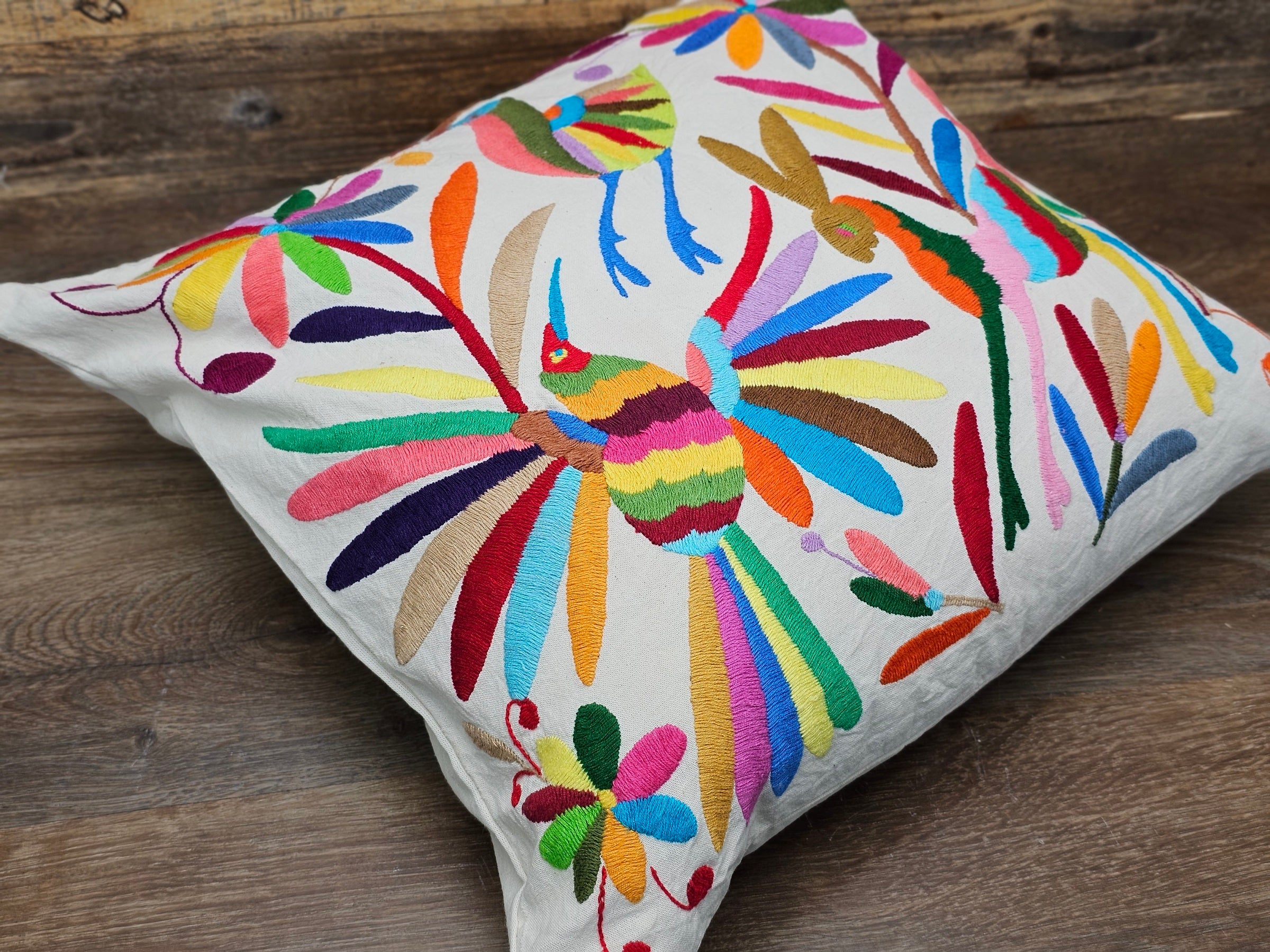Otomi Tenango Pillow Cover Hand Embroidered with Birds, Flowers, and Animals in Vibrant Colors. Handmade in Mexico. Ships from the USA. Buy now at www.felipeandgrace.com. 