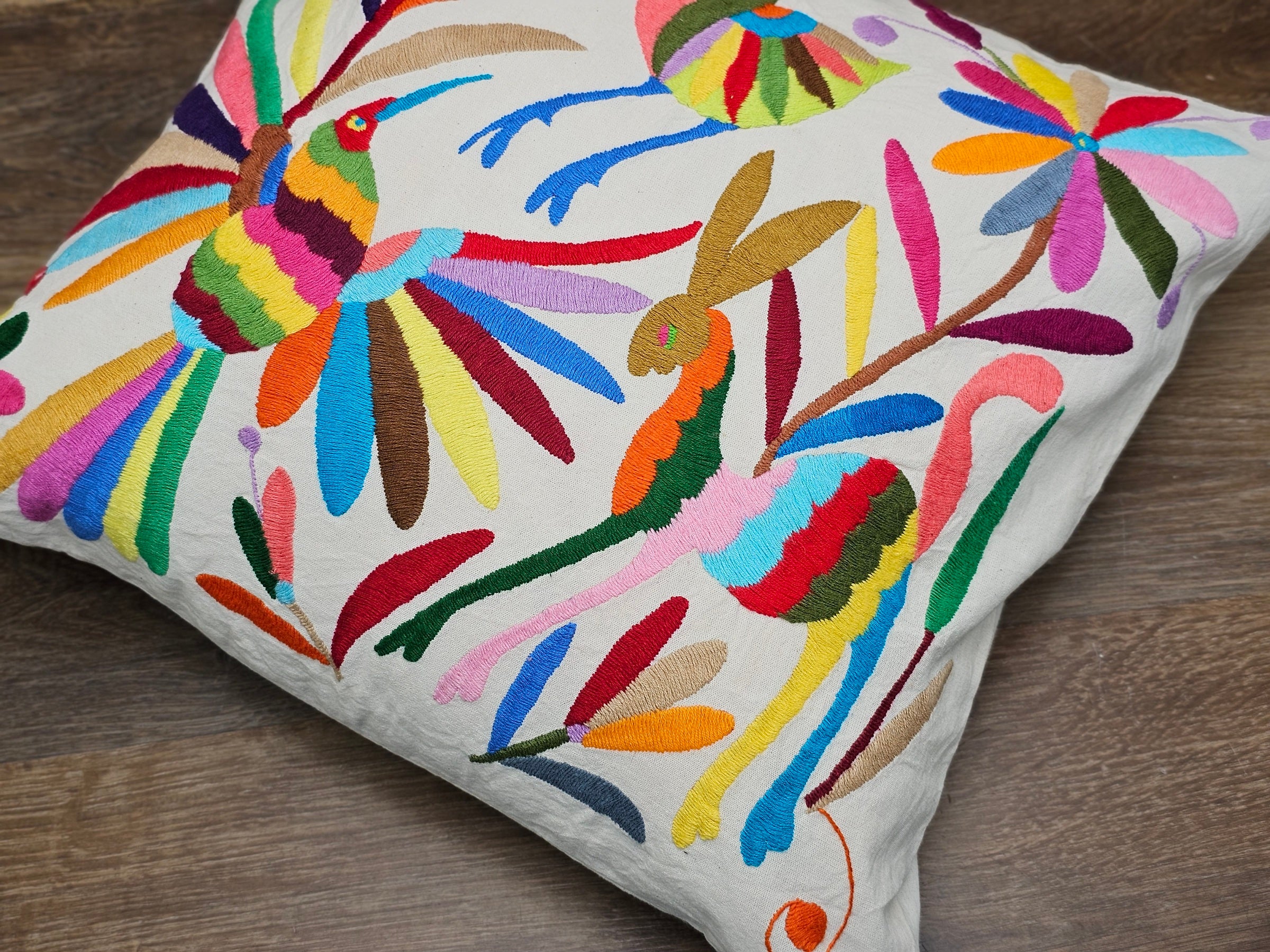 Otomi Tenango Pillow Cover Hand Embroidered with Birds, Flowers, and Animals in Vibrant Colors. Handmade in Mexico. Ships from the USA. Buy now at www.felipeandgrace.com. 