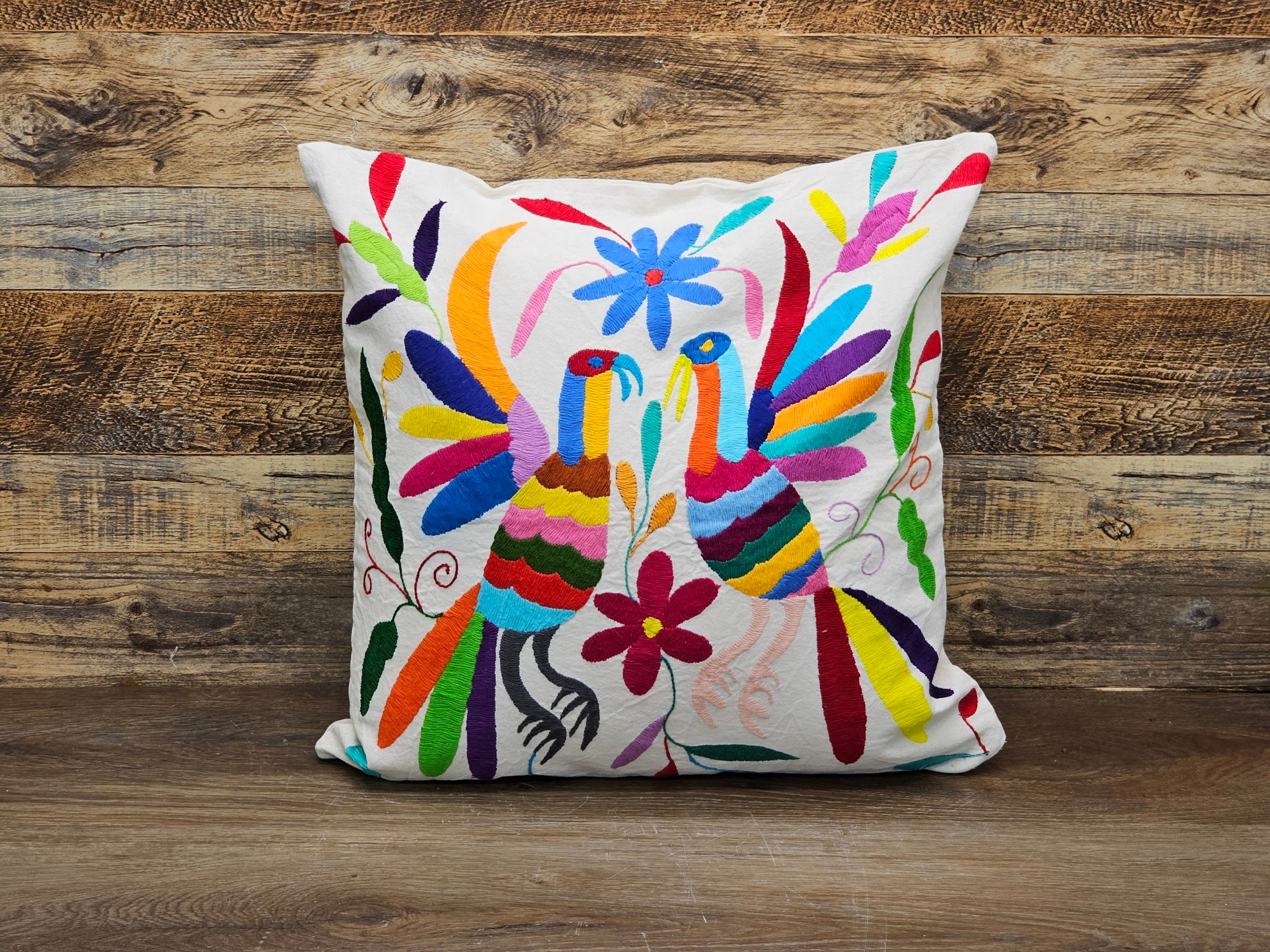 Rainbow Color Square Otomi Tenango Pillow Cover Handmade and Hand Embroidered in Mexico. Ships from the USA. Buy now at www.felipeandgrace.com.
