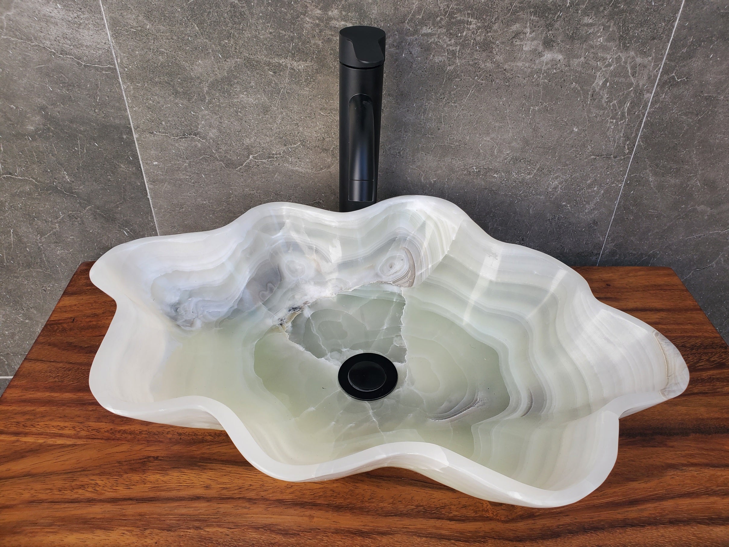 White Onyx Stone Bathroom Vessel Sink. Above counter sinks. High-polished Epoxy and Light Stone Sealant for the inner bowl are available. Hand finished. Made in Mexico. Hand Finished in USA. Buy Now at www.felipeandgrace.com