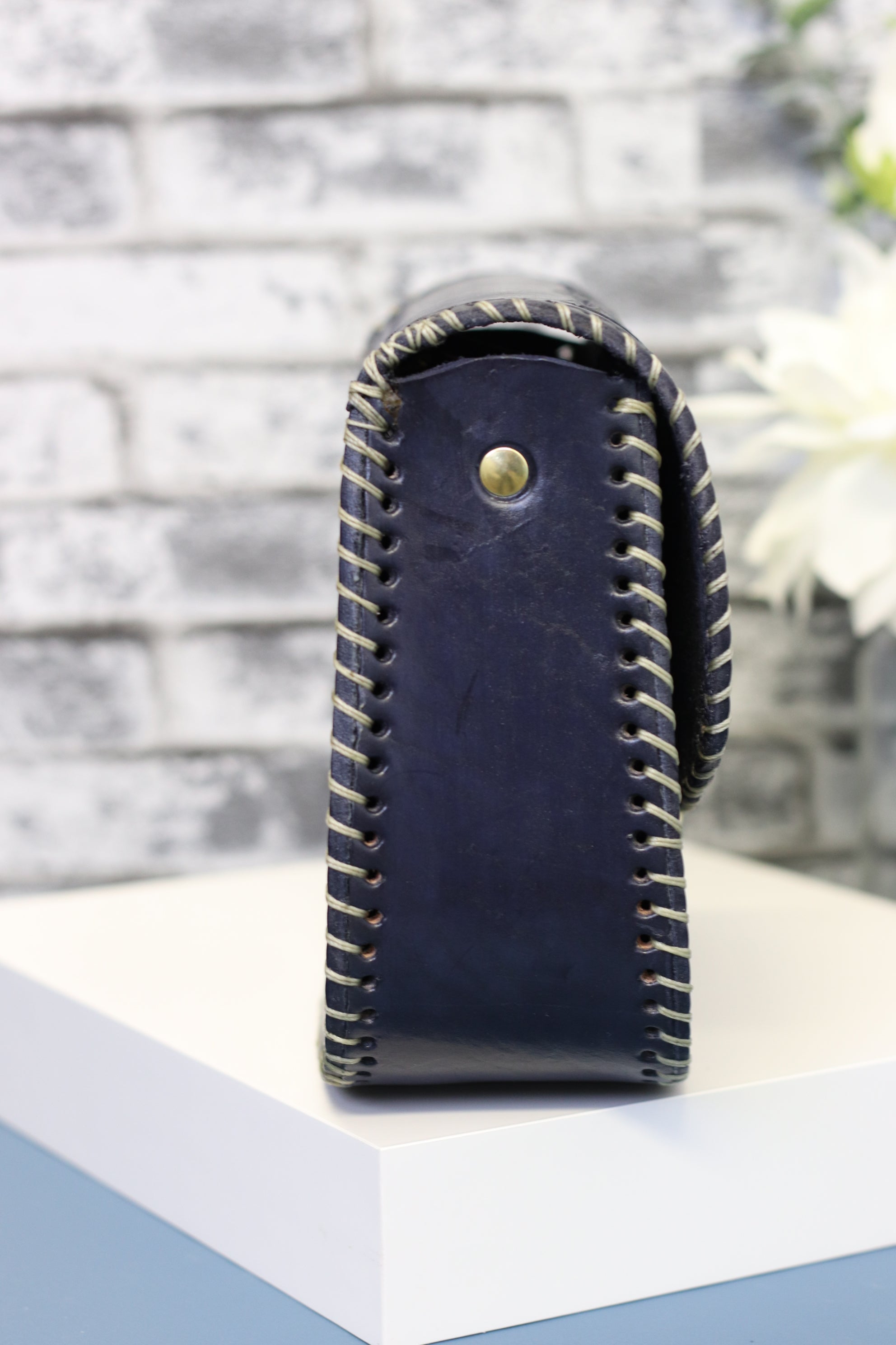 Blue leather clutch, hand-tooled leather with gold clasp closure. Clutch Handbag. Made by artisans in Central Mexico, shipping from the USA. Handmade. Buy now at www.felipeandgrace.com. 