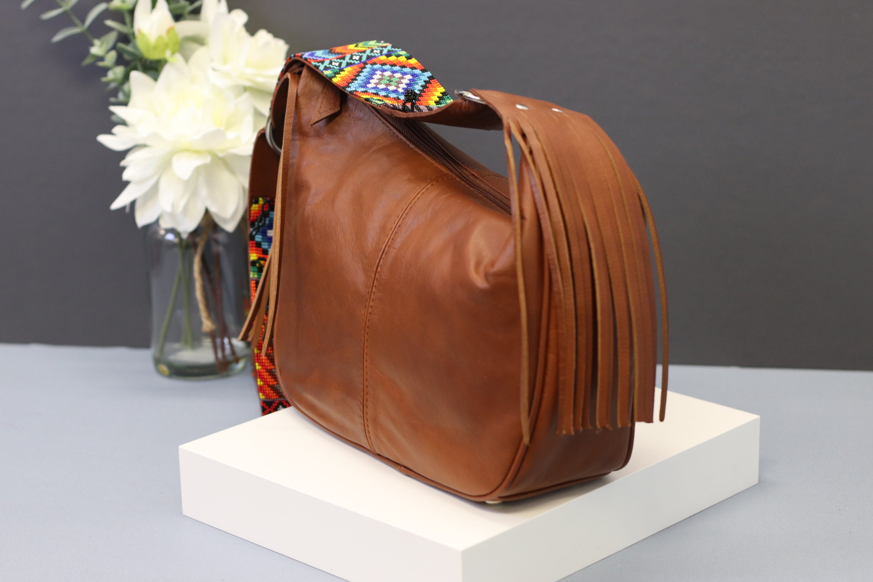 Brown Leather Messenger Bag with Hand Beaded Seed Bead Shoulder Strap. Handmade, Fast Shipping. Brown, Tan, with handles and a long strap. Cowhide Leather with Seed Bead Accent. Buy now at www.felipeandgrace.com