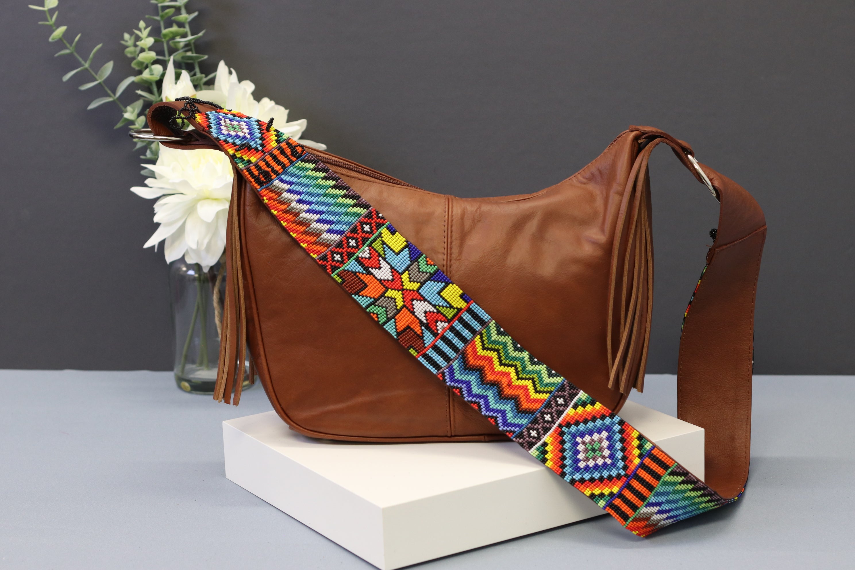 Brown Leather Messenger Bag with Hand Beaded Seed Bead Shoulder Strap. Handmade, Fast Shipping. Brown, Tan, with handles and a long strap. Cowhide Leather with Seed Bead Accent. Buy now at www.felipeandgrace.com