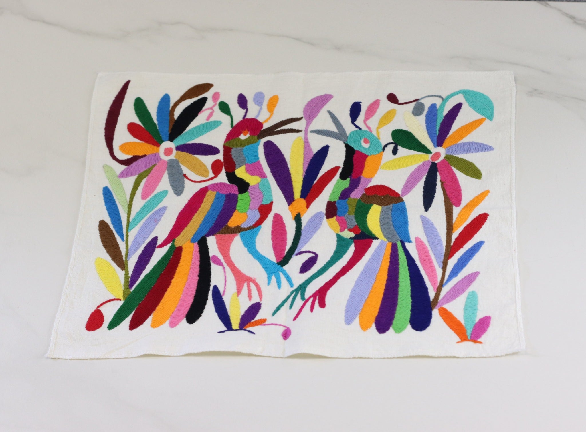 Otomi Tenango Placemat or Frameable Art Handmade with Embroidered Birds, Flowers, and Animals in Vibrant Colors. Handmade in Mexico. Ships from the USA. Buy now at www.felipeandgrace.com. 