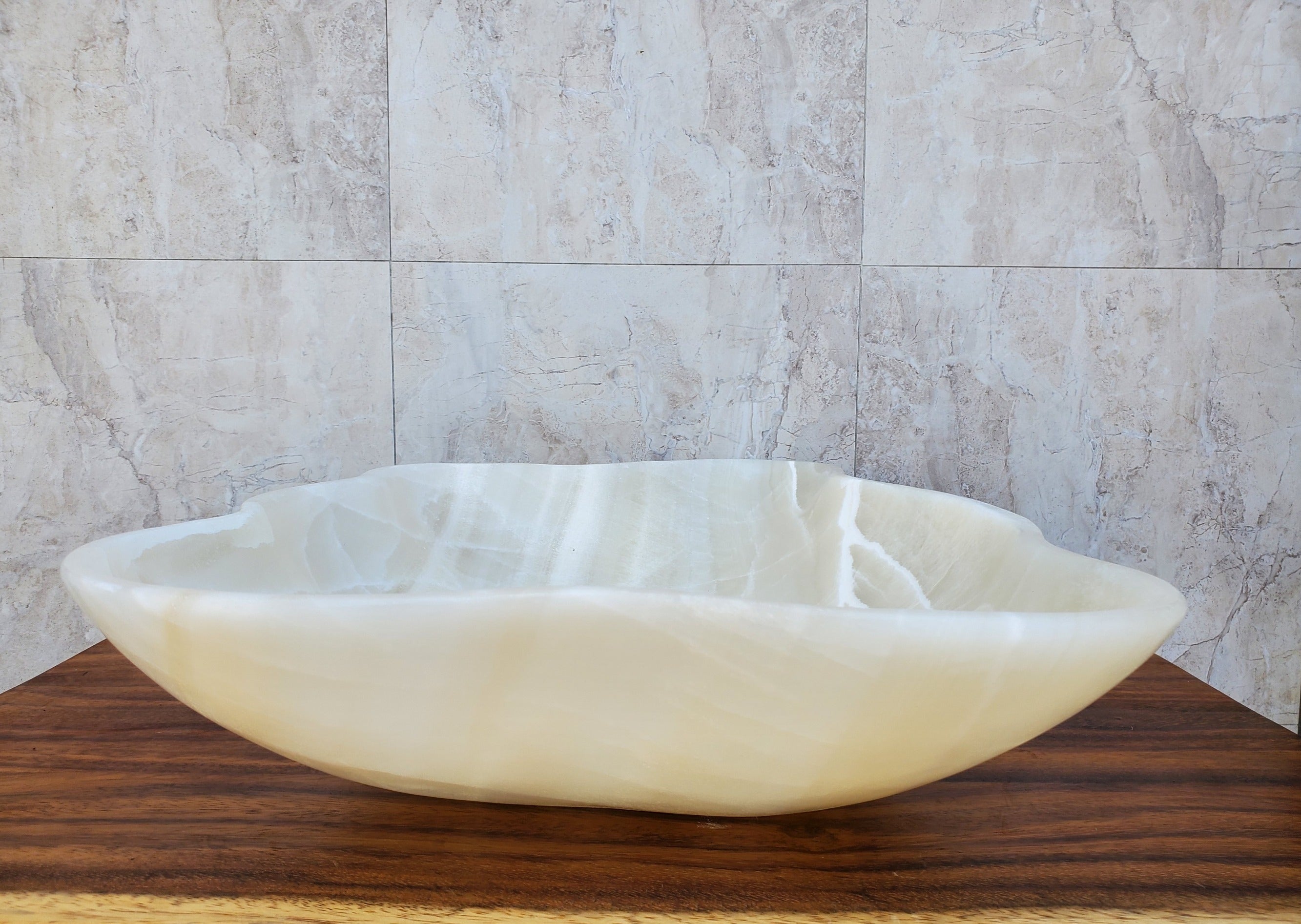 White Polished Onyx Stone Vessel Bathroom Sink. Above Counter. It is one of a kind and a beautiful work of art. Handmade in Mexico. Hand Finished in the USA. Ships from the USA. Buy now at www.felipeandgrace.com. 