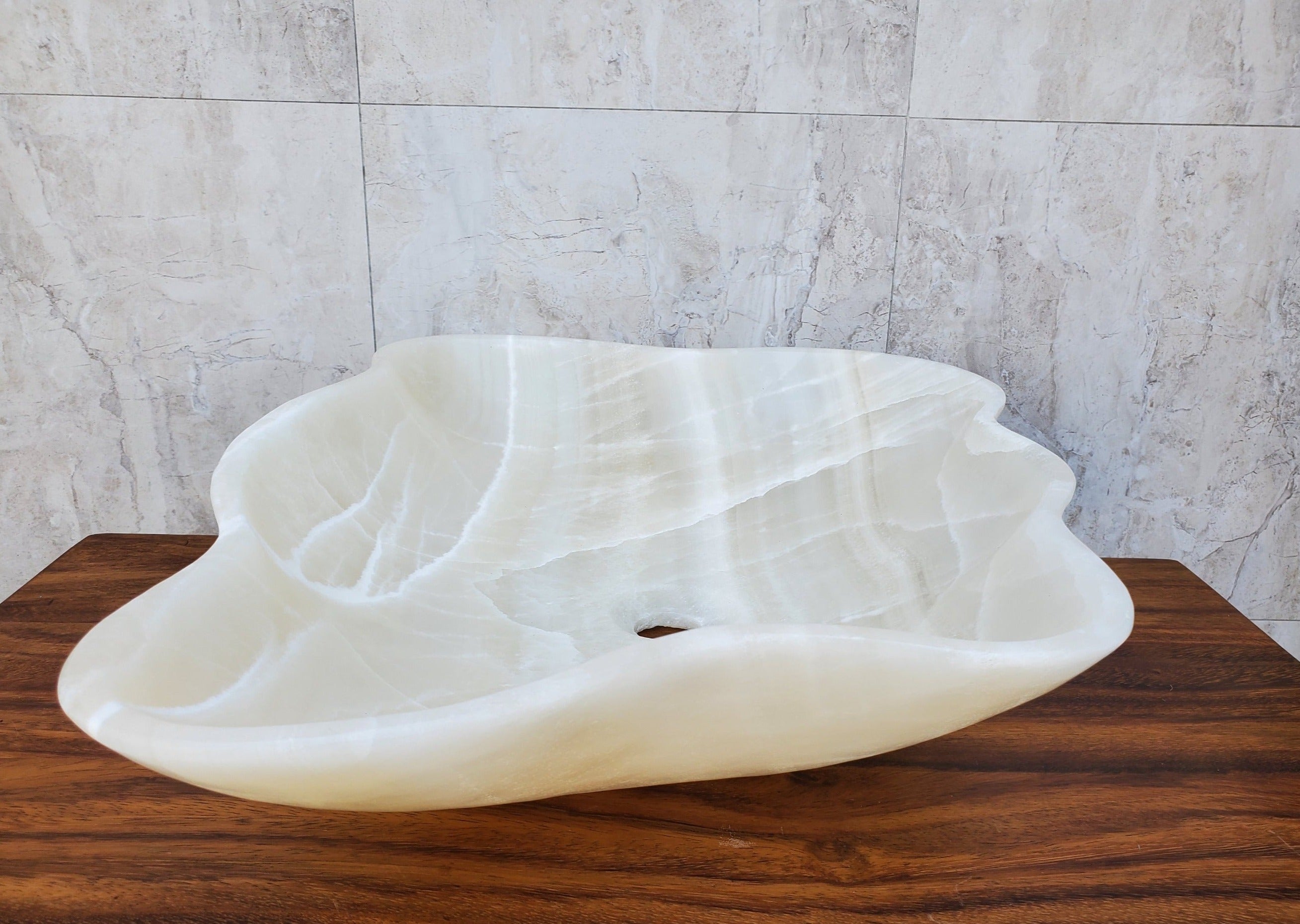 White Polished Onyx Stone Vessel Bathroom Sink. Above Counter. It is one of a kind and a beautiful work of art. Handmade in Mexico. Hand Finished in the USA. Ships from the USA. Buy now at www.felipeandgrace.com. 