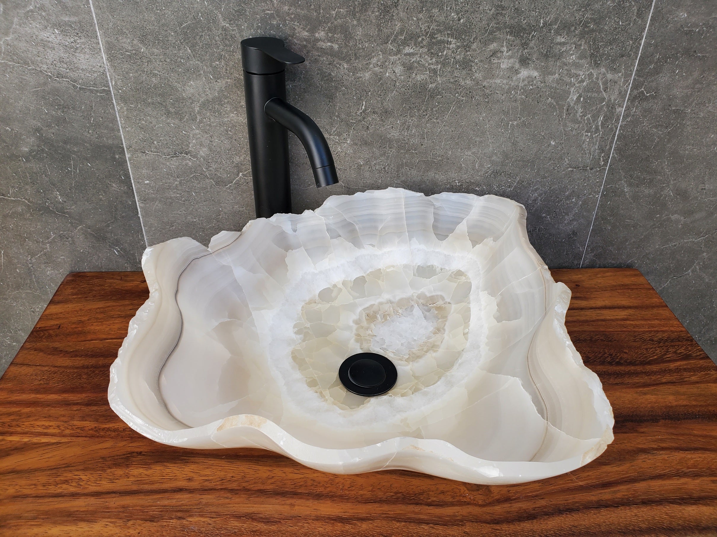 Transparent Onyx Stone Bathroom Vessel Sink. Epoxy Sealant is available Fast shipping. Standard drain size. A beautiful work of art. Handmade. Buy Now at www.felipeandgrace.com.