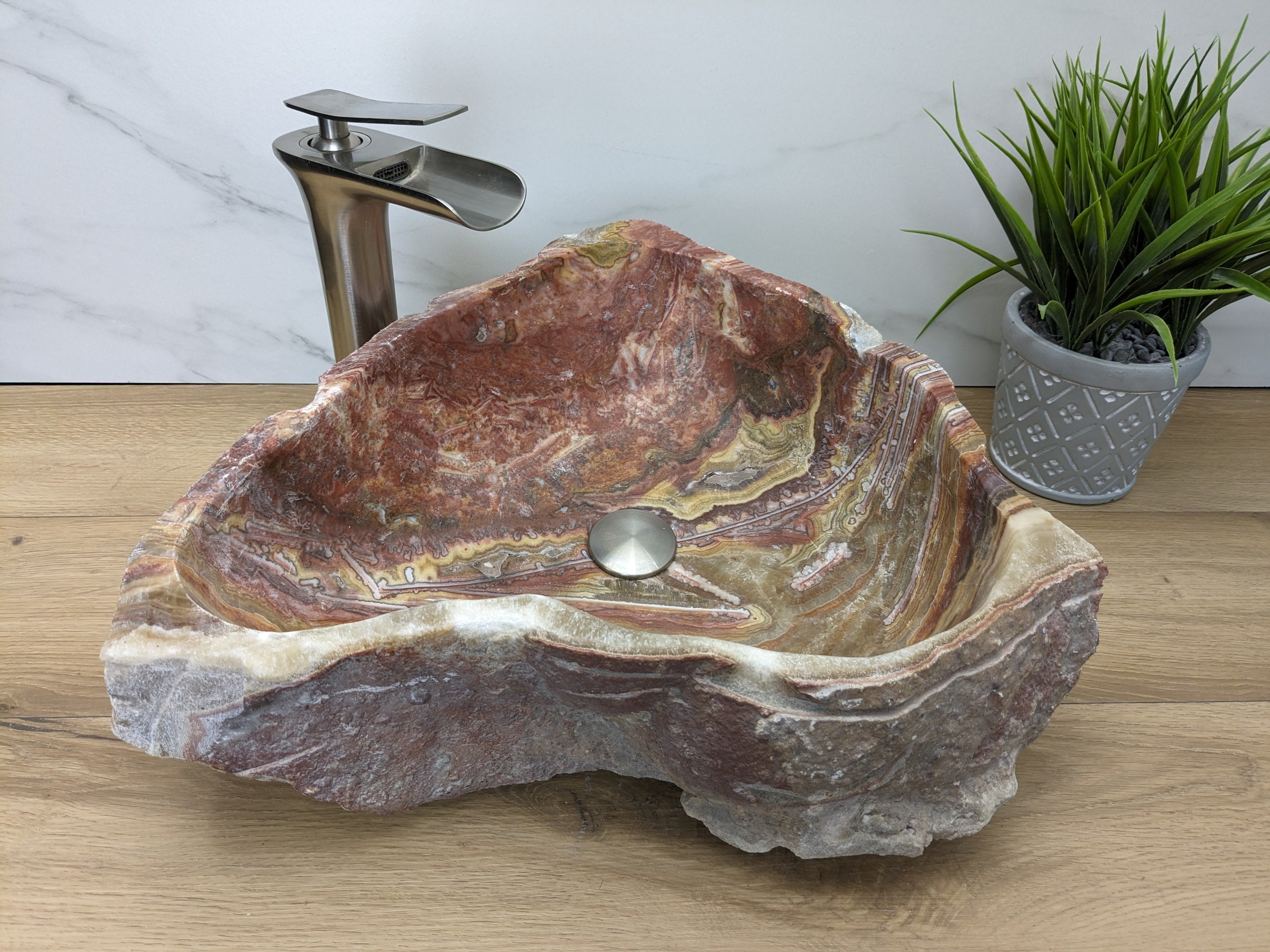 Pink and Tan Onyx Stone Vessel Bathroom Sink. Epoxy Sealant is available with fast shipping. Standard Drain Size. A beautiful work of rustic art. Handmade. Buy Now at www.felipeandgrace.com