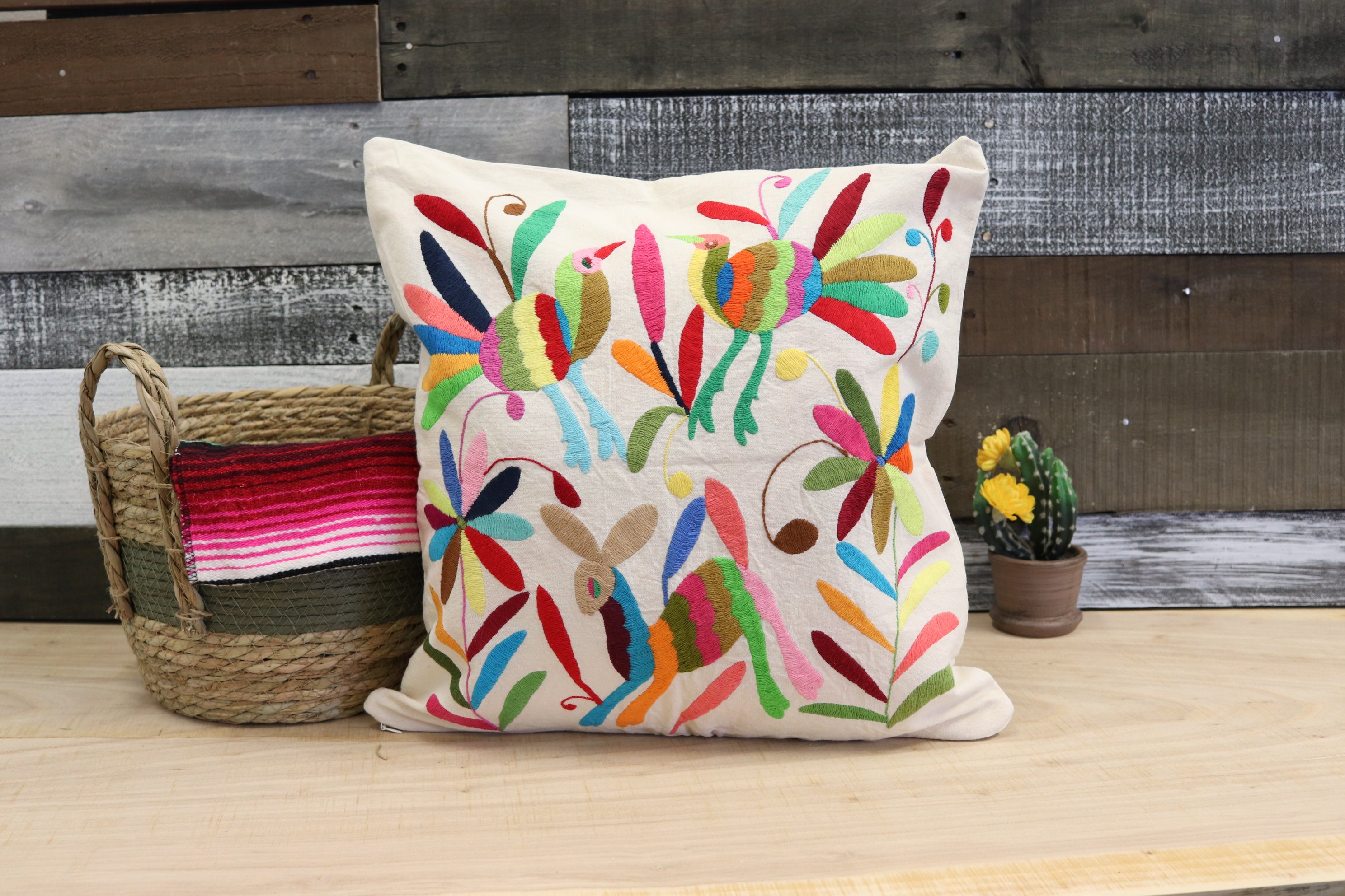 Square Otomi Tenango Pillow Cover with Hand Embroidered Animal, Bird and Flower Design in Vibrant Colors. Handmade in Mexico. Ships from the USA. Buy now at www.felipeandgrace.com.