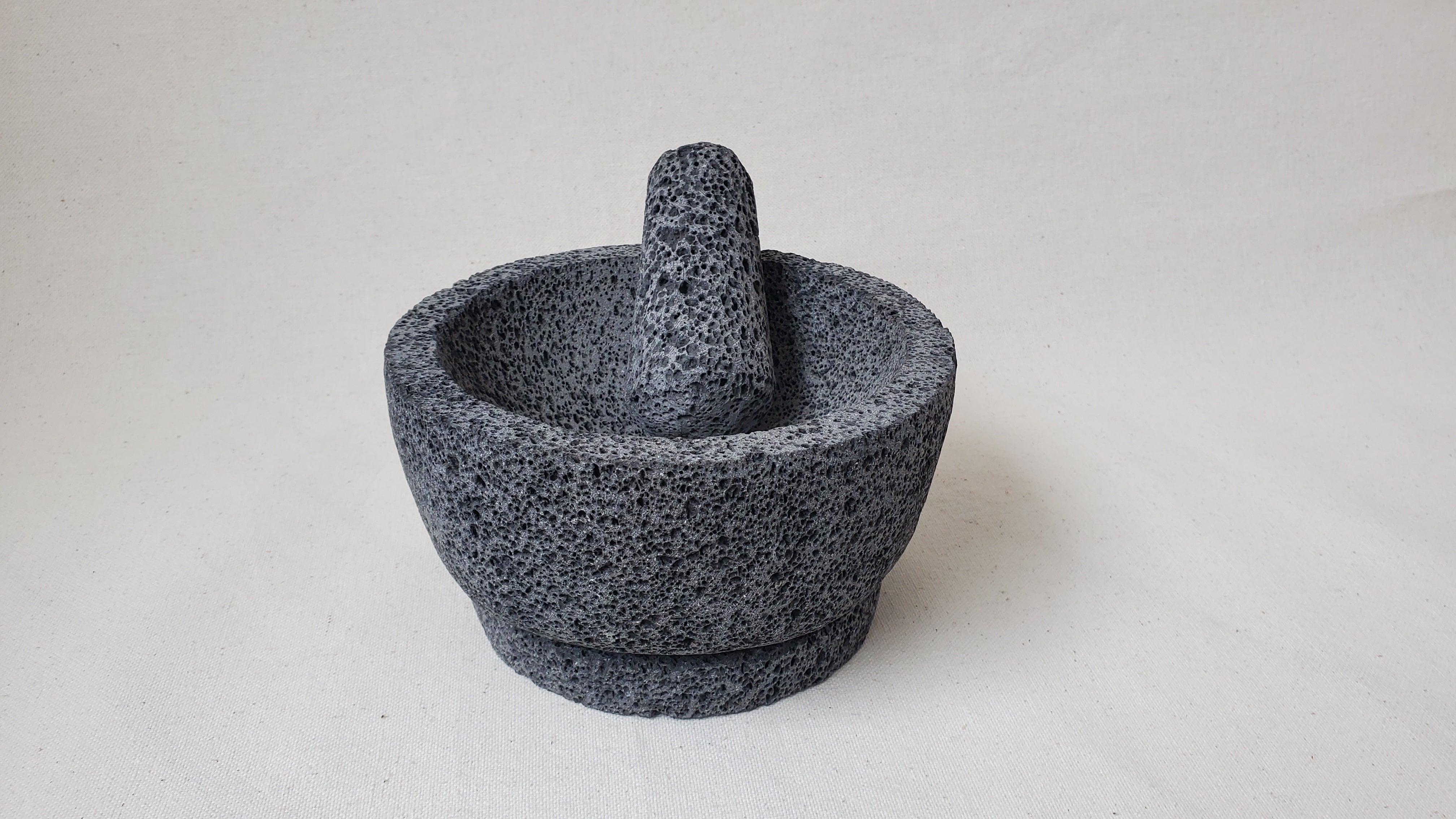 Authentic 8-inch Molcajete Pestle and Mortar Set. Made of pure basalt volcanic lava rock. Handmade in Mexico using traditional techniques. We hand finish, package, and ship from the USA. Buy now at www.felipeandgrace.com.