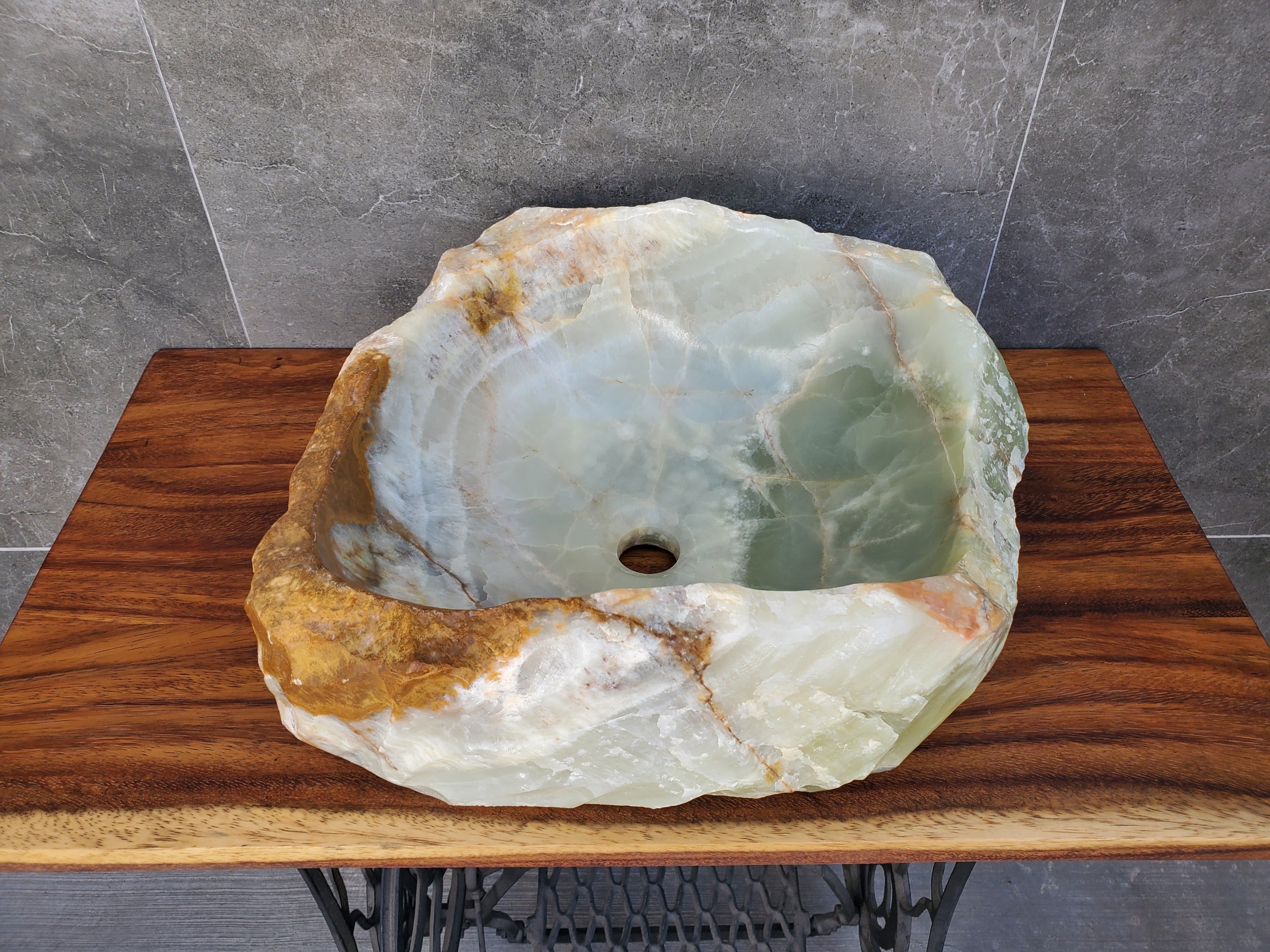 Green and Brown Onyx Stone Vessel Bathroom Sink. Above Counter. It is one of a kind and a beautiful work of art. Handmade in Mexico. Hand Finished in the USA. Ships from the USA. Buy now at www.felipeandgrace.com. 