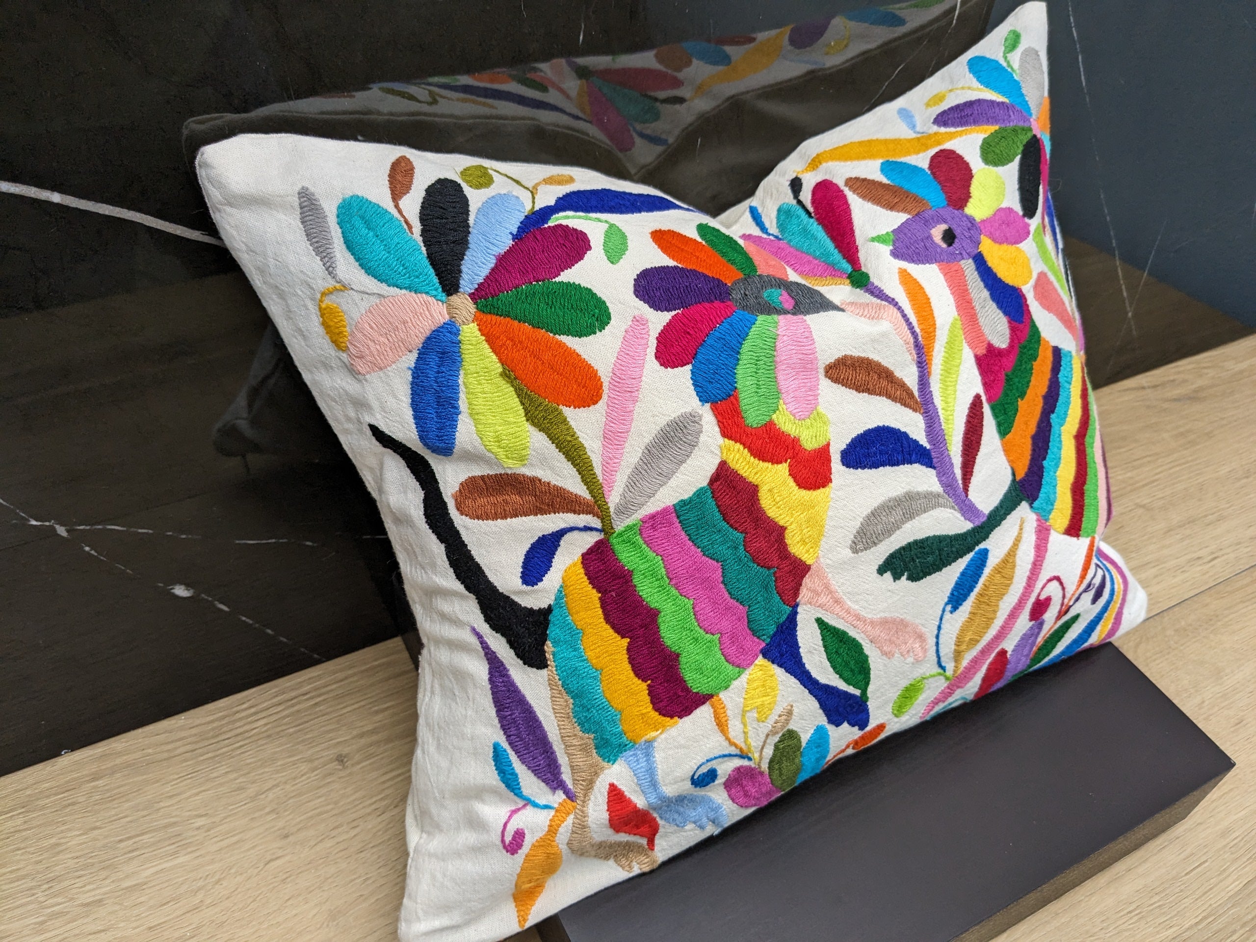 Rectangle Otomi Tenango Pillow Cover with Hand Embroidered Flowers and Animals in Vibrant Colors. Handmade in Mexico. We package and ship from the USA. Buy now at www.felipeandgrace.com.