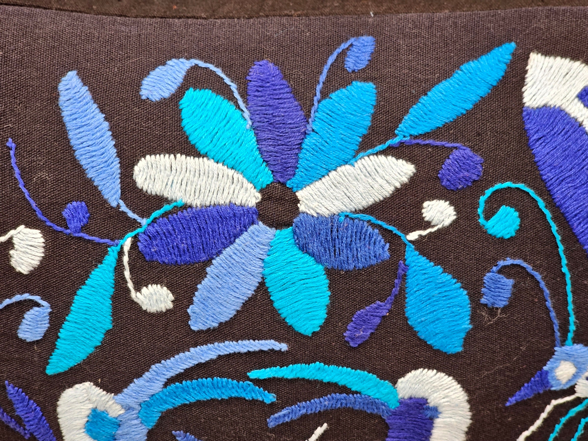 Light Blue, Dark Blue, Periwinkle and White Hand Embroidered Bird, Dragonfly and Flower Pattern Stitched on Black Background Otomi Tenango Pillow Cover. Handmade in Mexico. Ships from the USA. Buy now at www.felipeandgrace.com. 